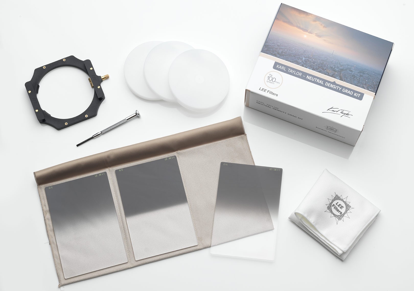 A Neutral Density Graduated Filter Kit. Top left: filter holder assembly and to its right, custom filter lens hoods. Bottom left: filters – soft, hard and medium edges.