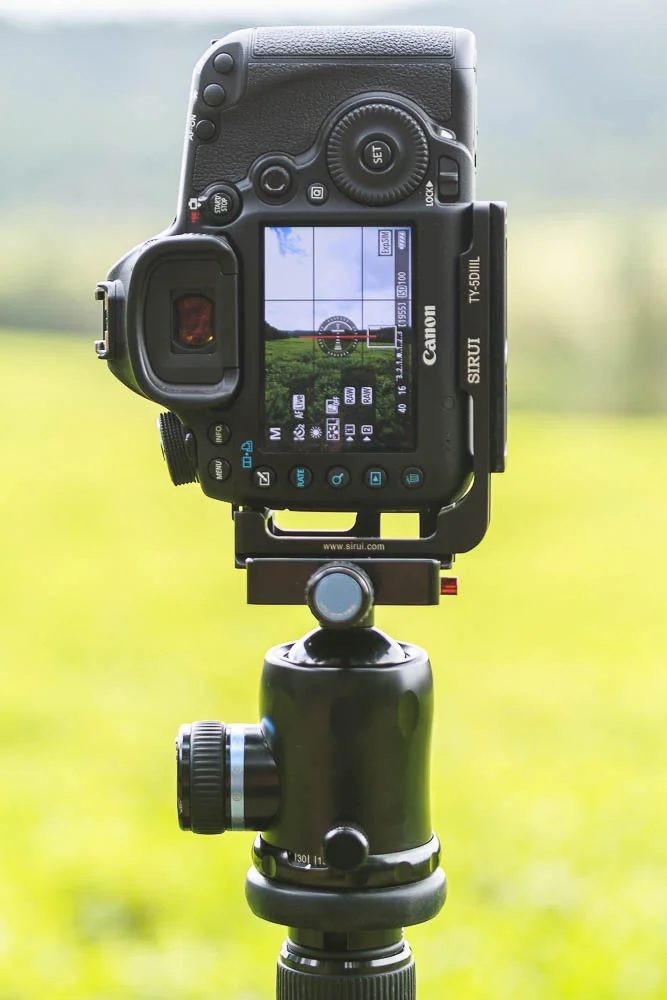 A camera in the upright portrait orientation using an L-bracket