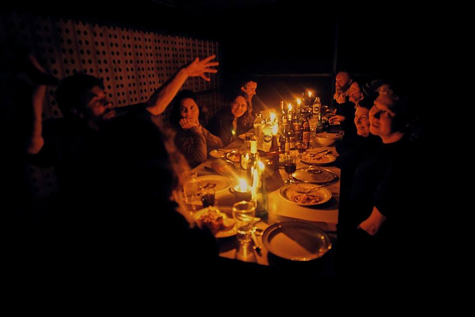 Candlelit dinner party at the lighthouse with Cameron Robbins channelling cuttlefish communiques on the left.