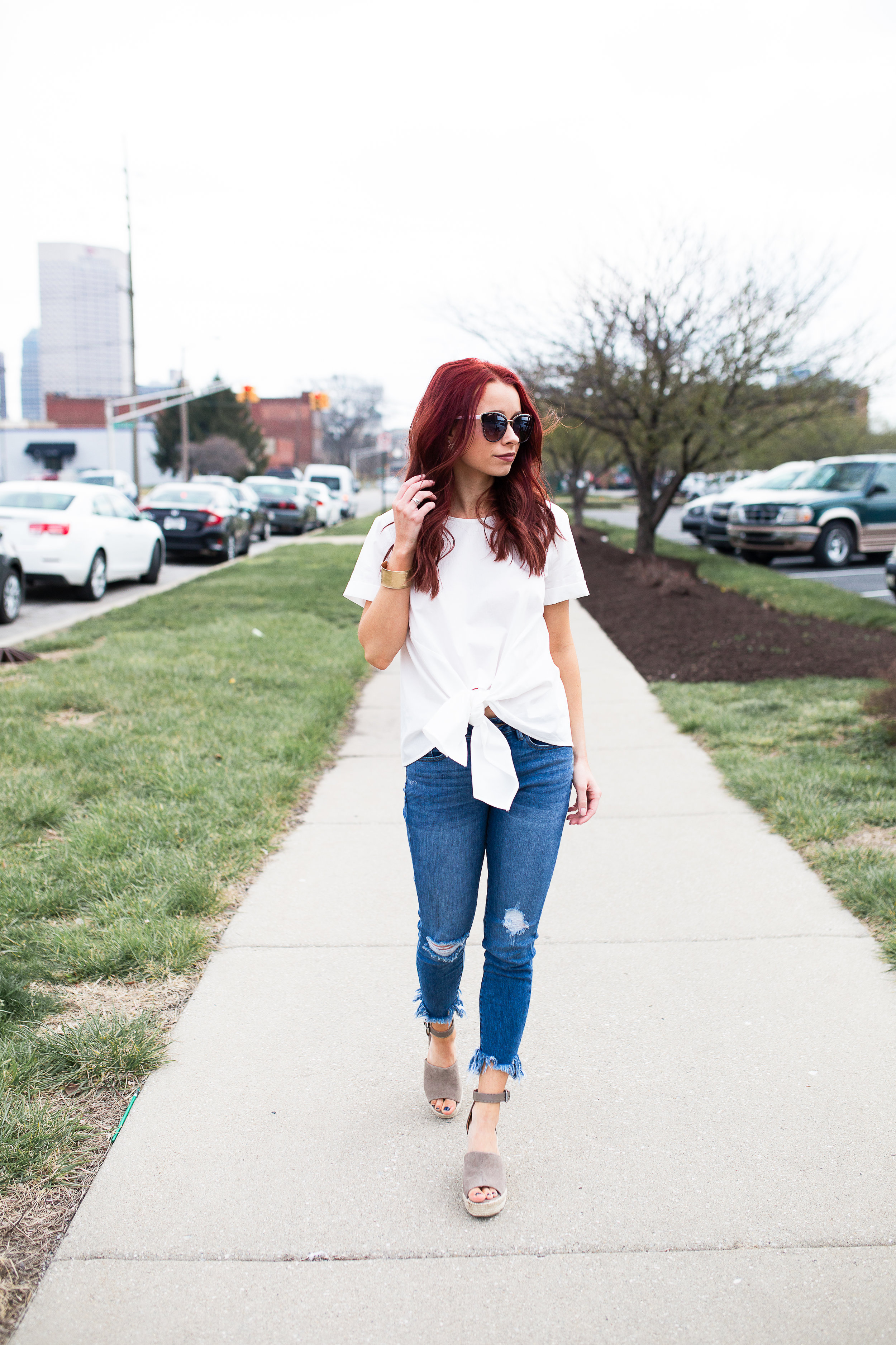 White Tie Front Top, RaeLynn's Boutique || Fringe Jeans, RaeLynn's Boutique || Gold Bracelet, The Mason Jar Boutique || Sunnies, Red Dress Boutique || Steve Madden Wedges, DSW || Photography, Casey Ardizzone || Use the code TRENDY15 for 15% off at RaeLynn's Boutique