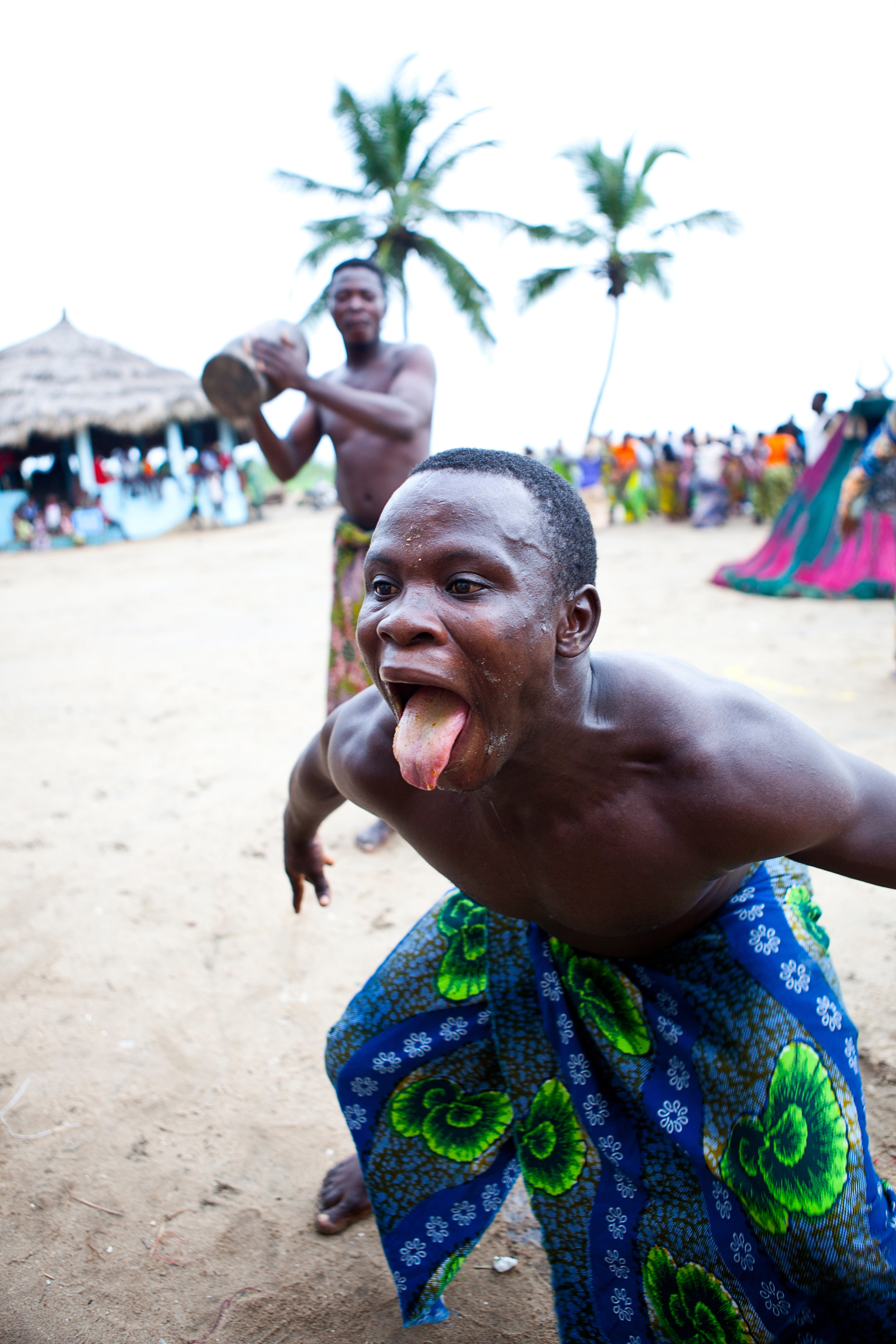 Man eating glass, Zangbeto ritual, Benin, West Africa.jpg