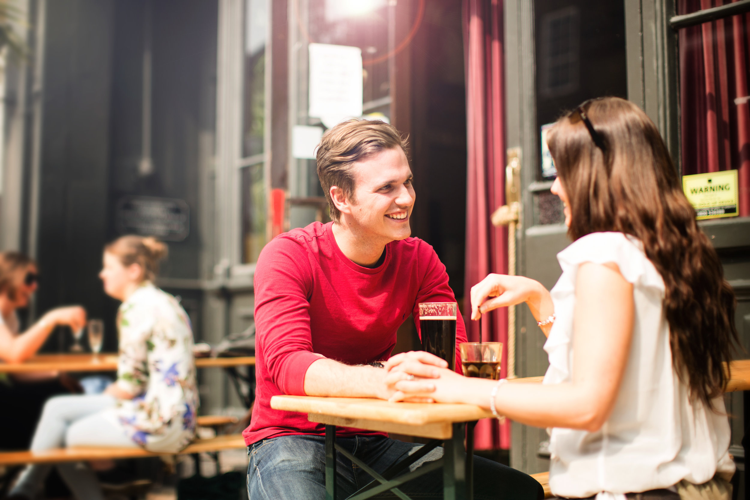 Couple relaxing in pub, London.jpg