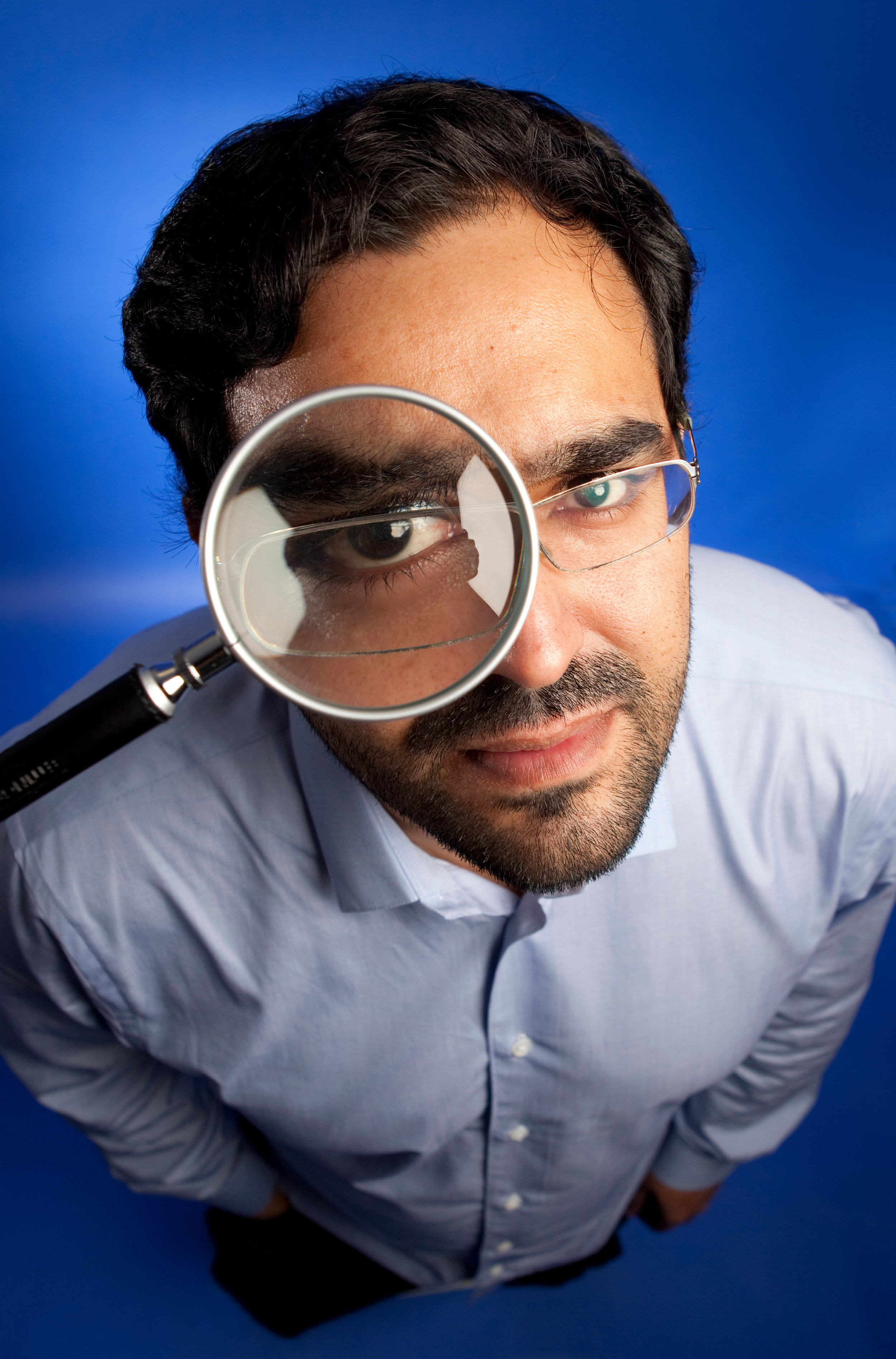 Man in a magnifying glass, London, Uk.jpg