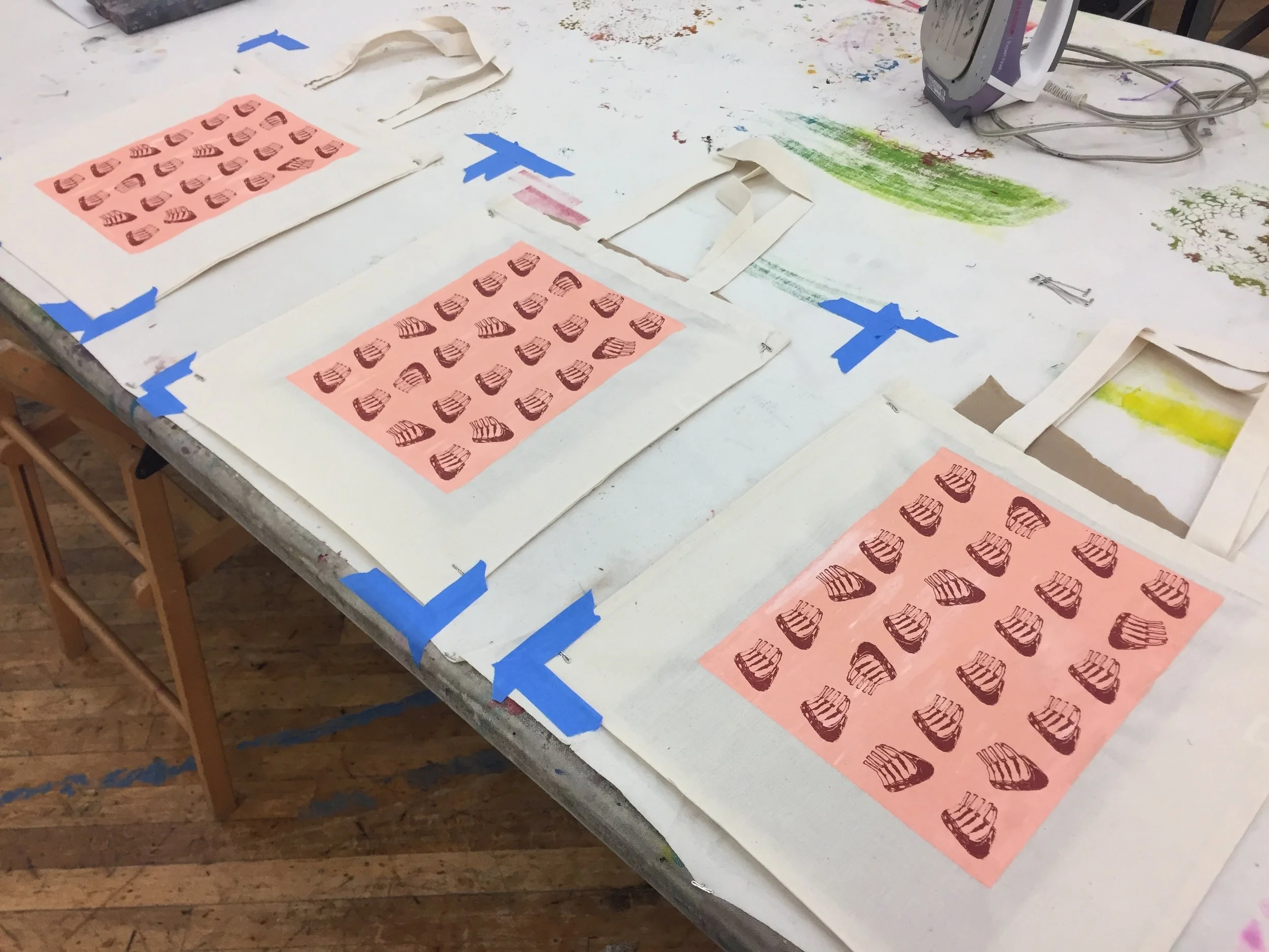 Screenprinted tote bags in progress.