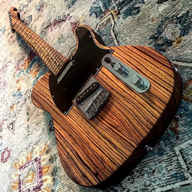 This one never gets old.  Ready for a restring 😬 #teletuesday #tele #telecaster #zebrawood #dowoodworking #boutiqueguitars #boutiqueguitar #handmadeguitar #handmadeguitars #electricguitars #electricguitar #guitarlife #guitaraddict #guitarbuilding #g