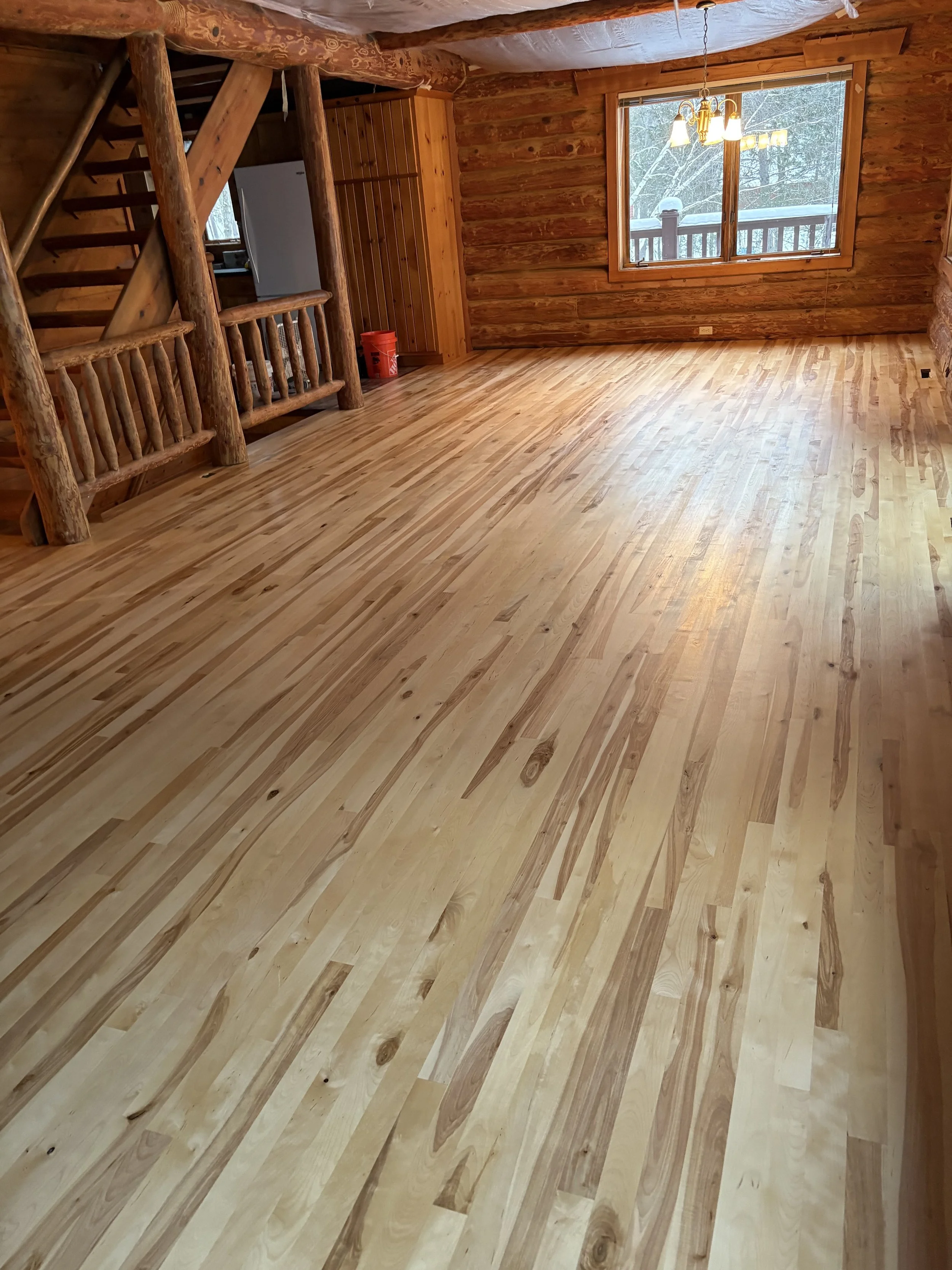 Newly installed birch flooring in cabin