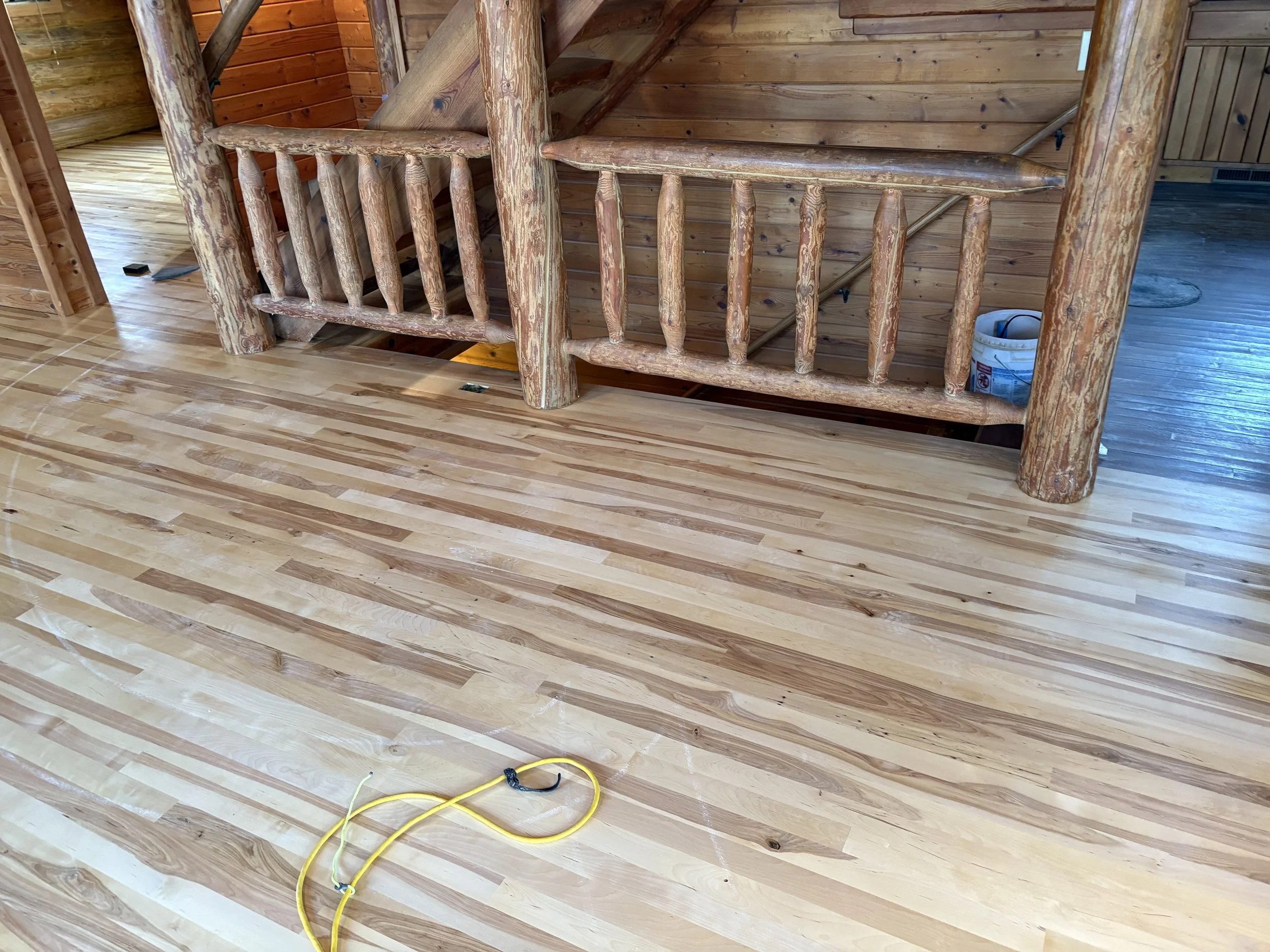 Newly installed birch flooring in cabin