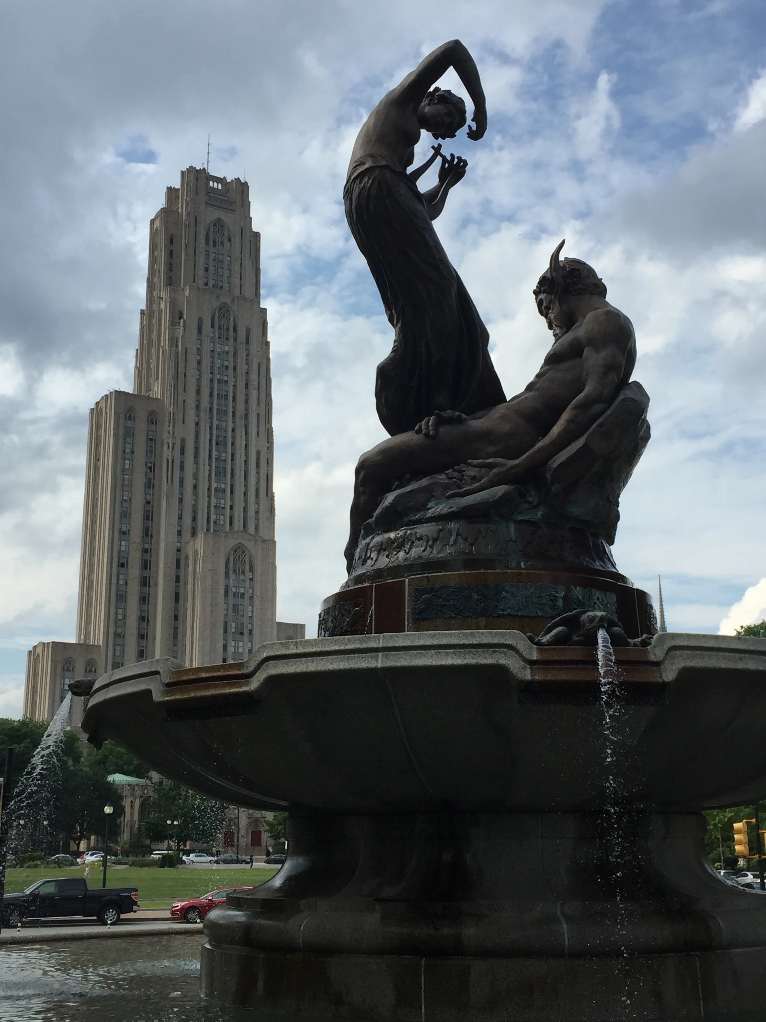 The Cathedral of Learning in the background, with the fountain of Pan and a nymph in the foreground.