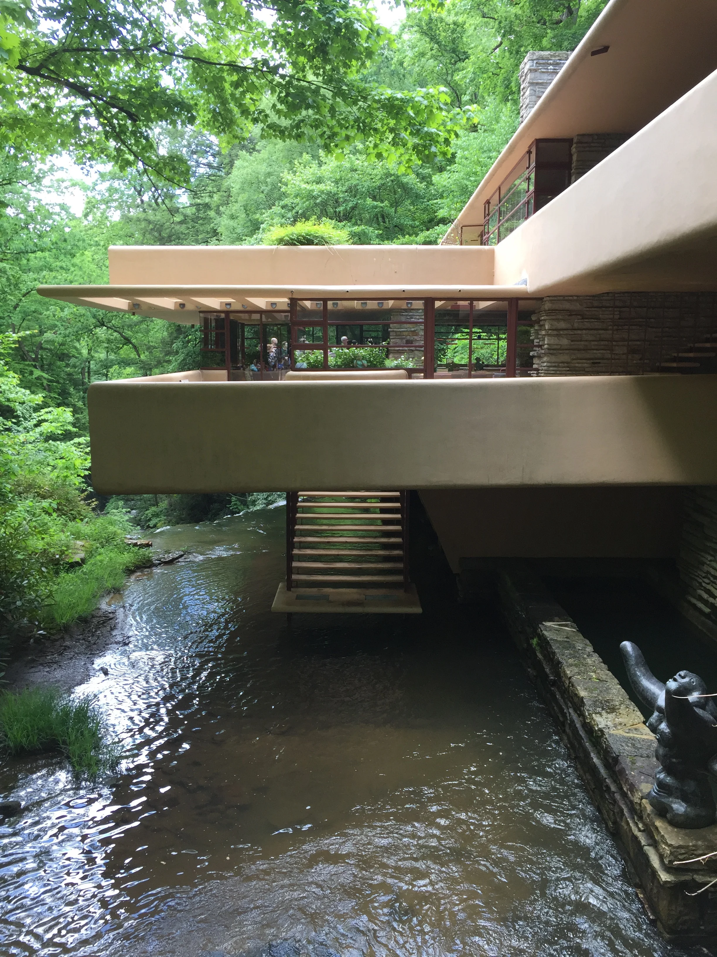 Fallingwater was built right on top of the river, which means Wright had to use a cantilever system to anchor the portions of the house that extend over the river. He also used the natural coolness of the river as a natural air conditioner for the house, and as a ready-made swimming hole on hot summer days.