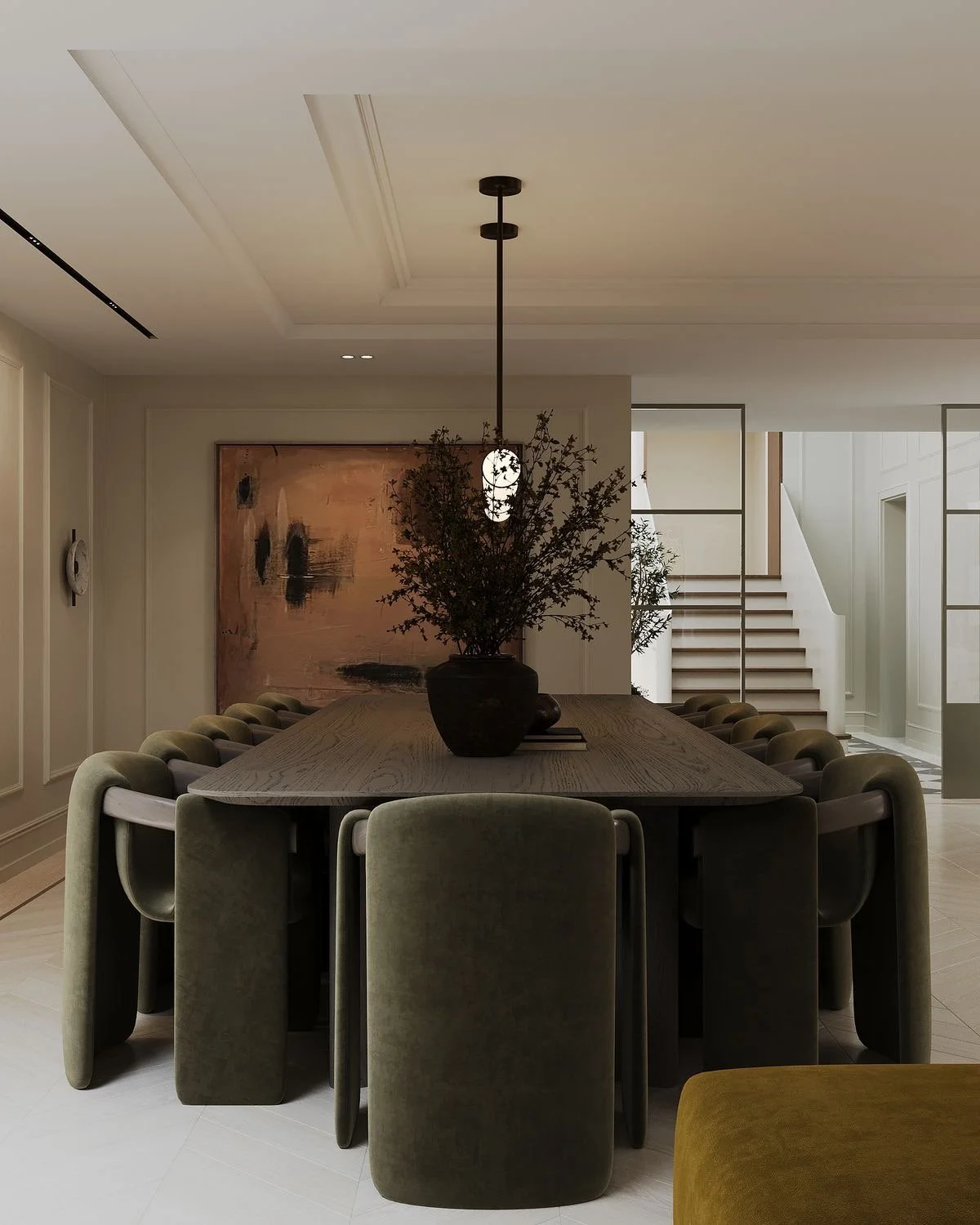 Contemporary dining space featuring a statement table, soft lighting and refined furniture styling.