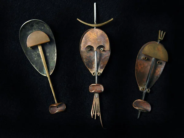 THREE MASK BROOCHES
