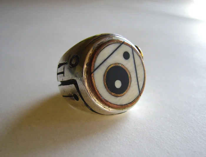 Dot Ring 1: Design Variation. Ebony and Ivory inlay, Sterling Silver, Copper, Brass and Red Bronze. Daniel Macchiarini