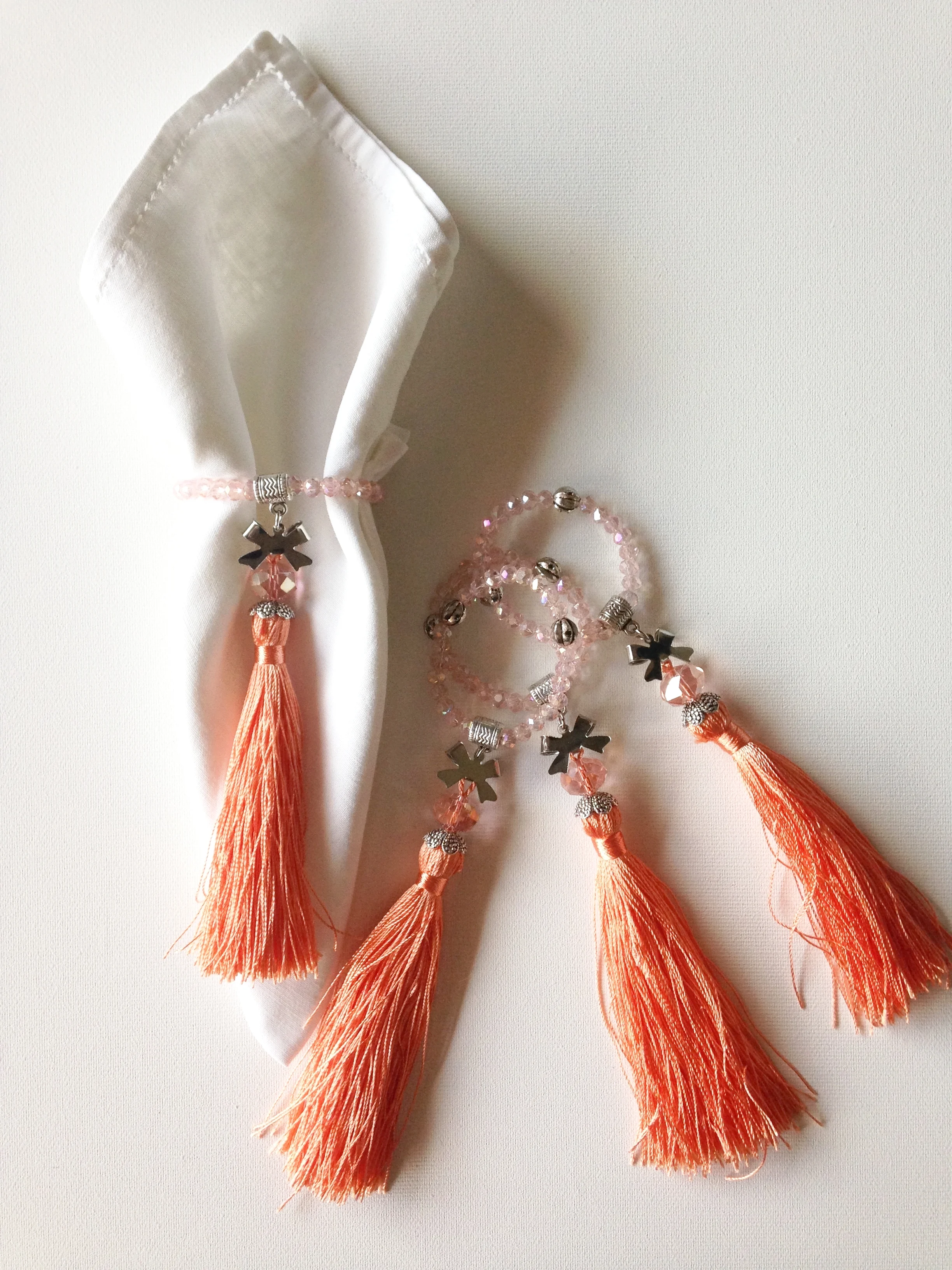  Salmon Orange Crystal with Matching Silk Tassle. &nbsp; $45 set of 12.  
