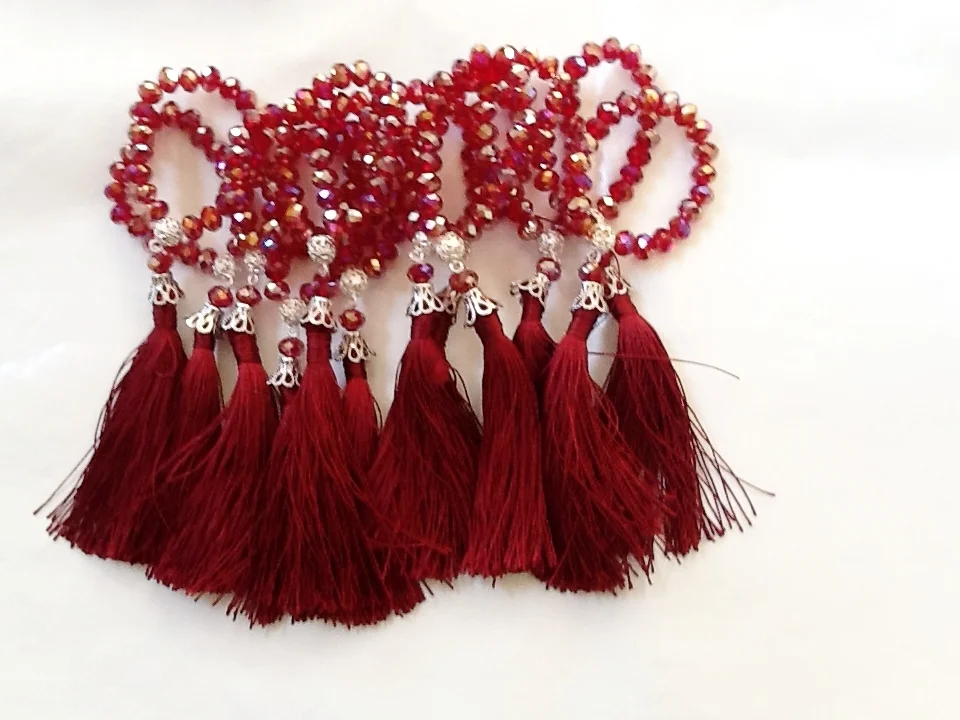  Ruby Red Crystal with Matching Silk Tassle. &nbsp;  $45 set of 12. Available in other colors.  