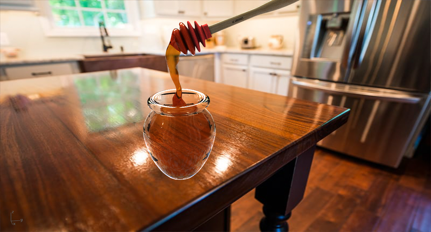 Le Creuset Honey dipper and glass jar of honey