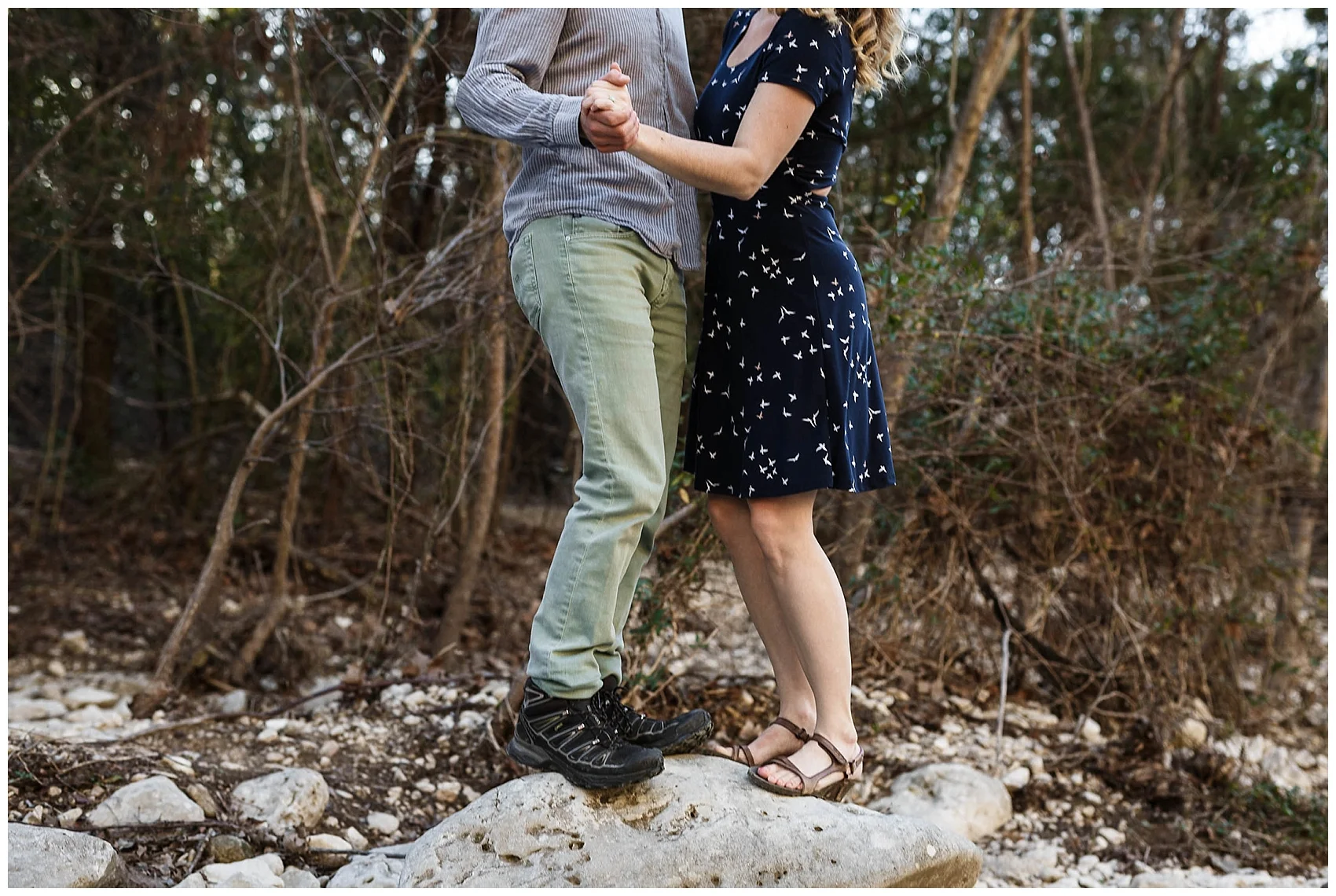 engaged couple walking in Austin's greenbelt