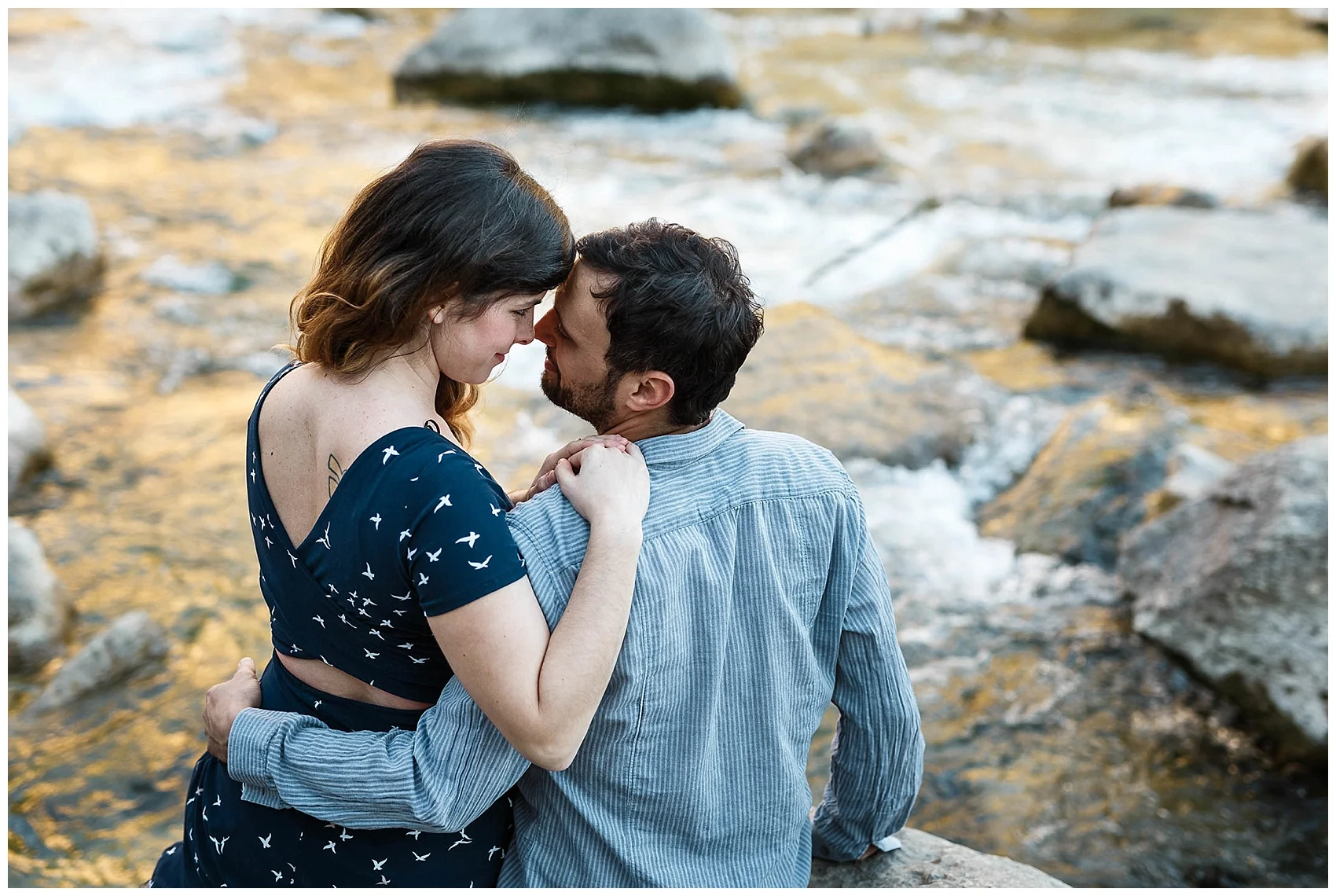 engaged couple sitting in Austin's greenbelt