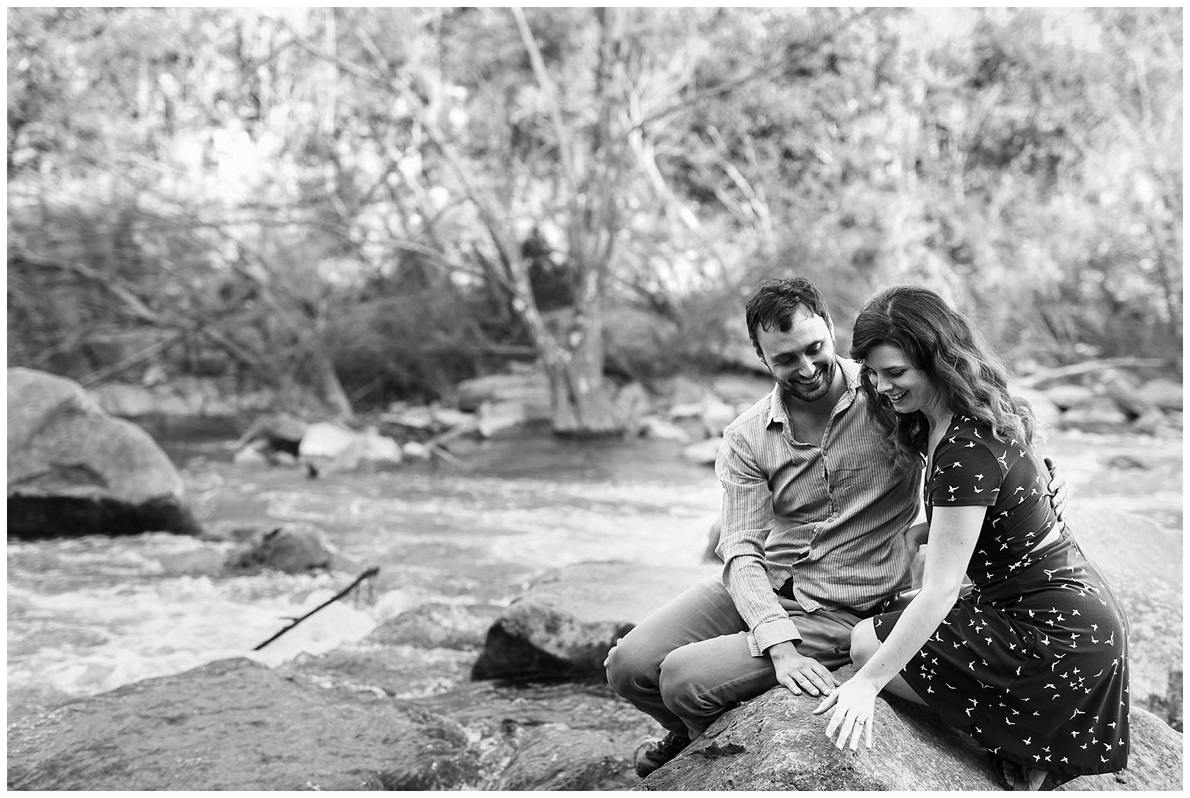 engaged couple sitting in Austin's greenbelt