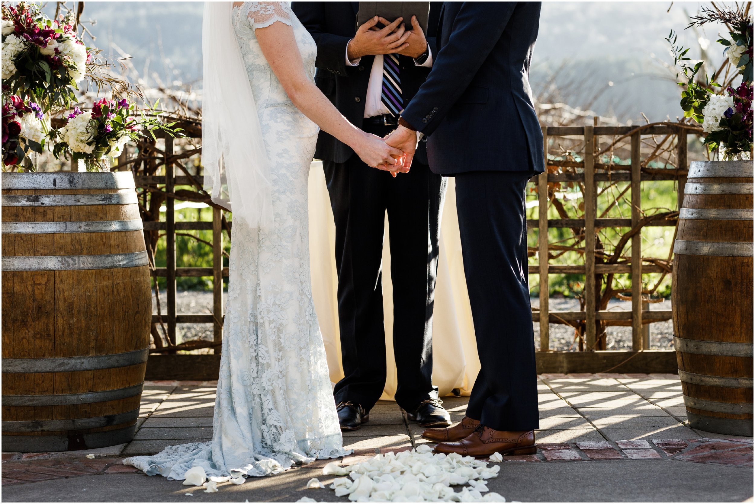 bride and groom holding hands during ceremony at the Harvest Inn