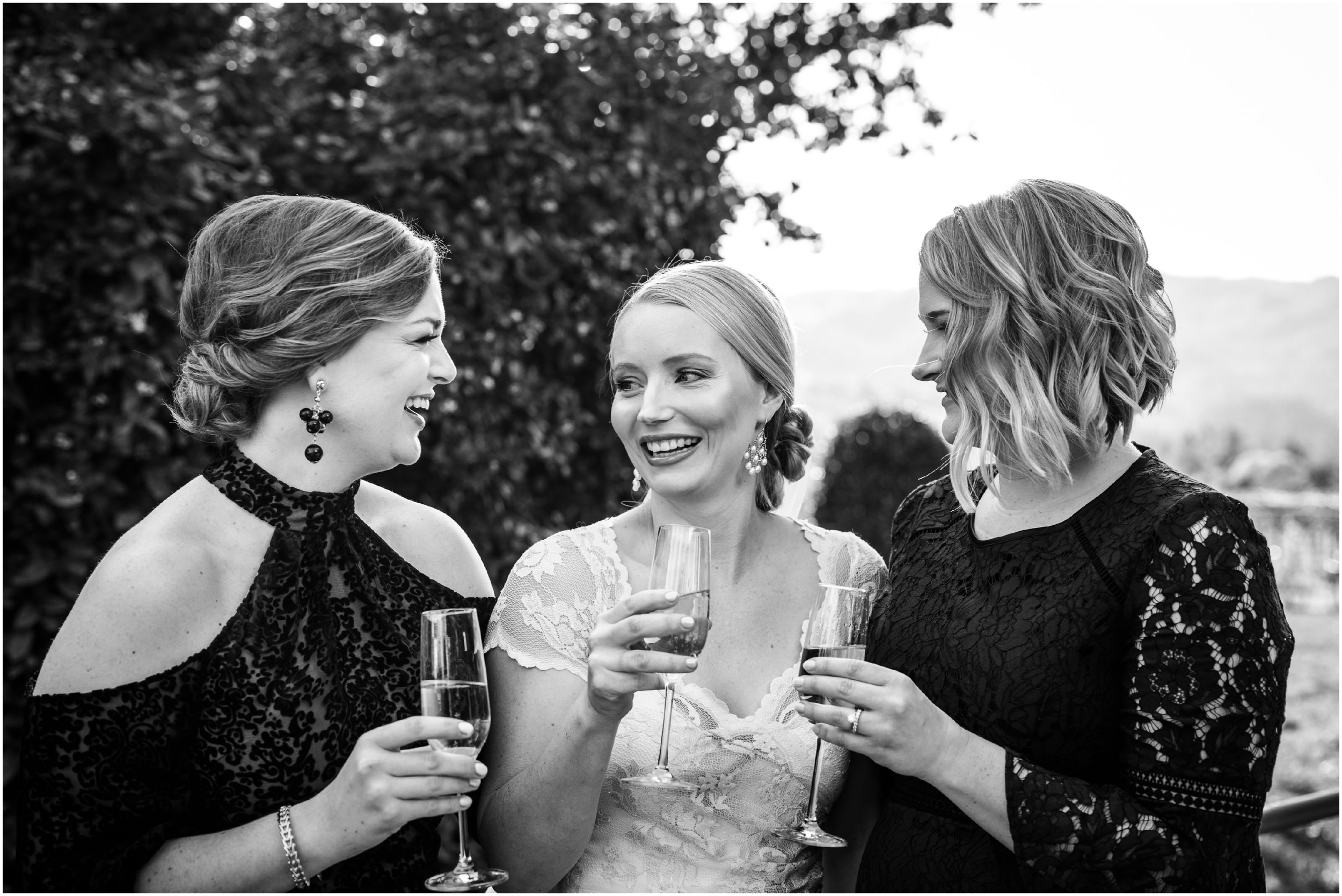 bride and bridesmaids drinking champagne 