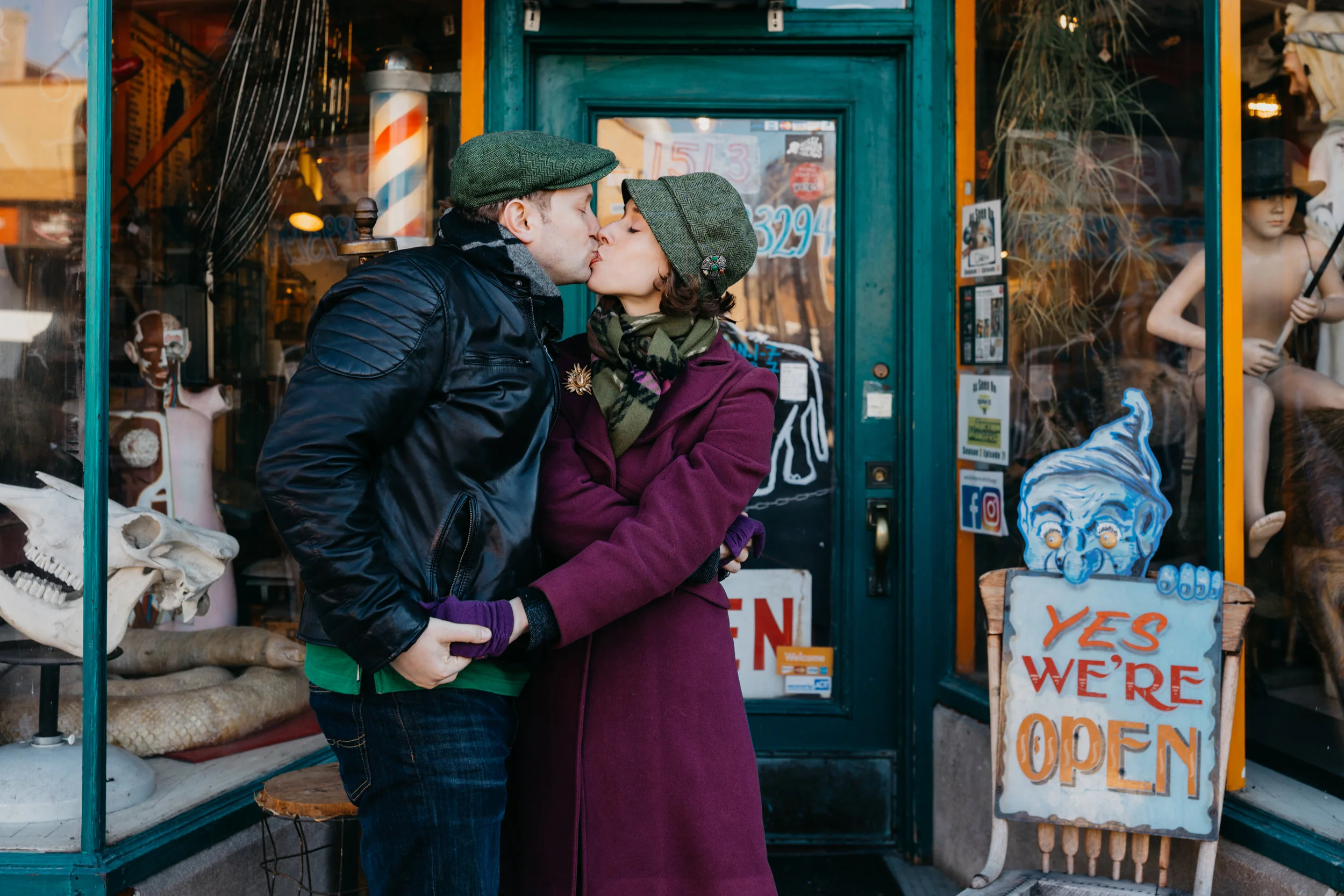 engaged couple kissing in Andersonville neighborhood of Chicago