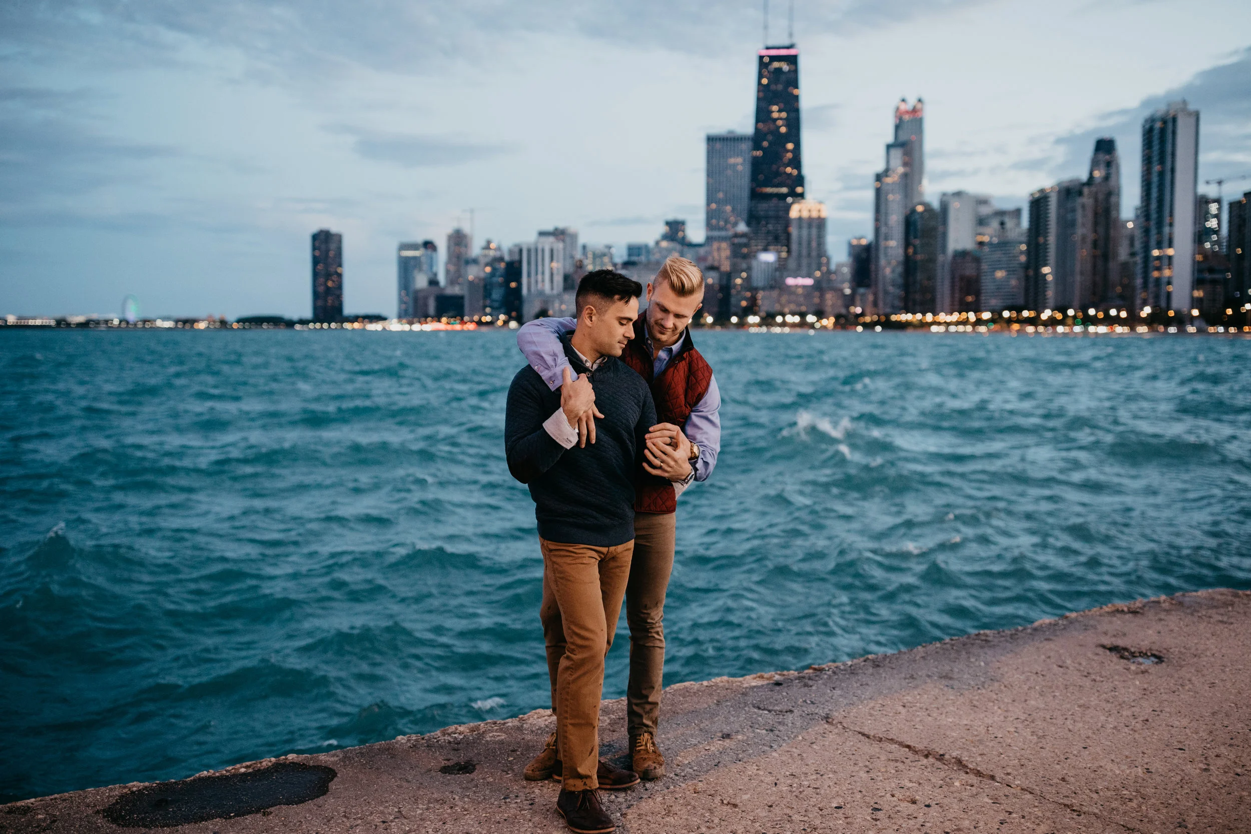 engaged couple posing on North Avenue beach