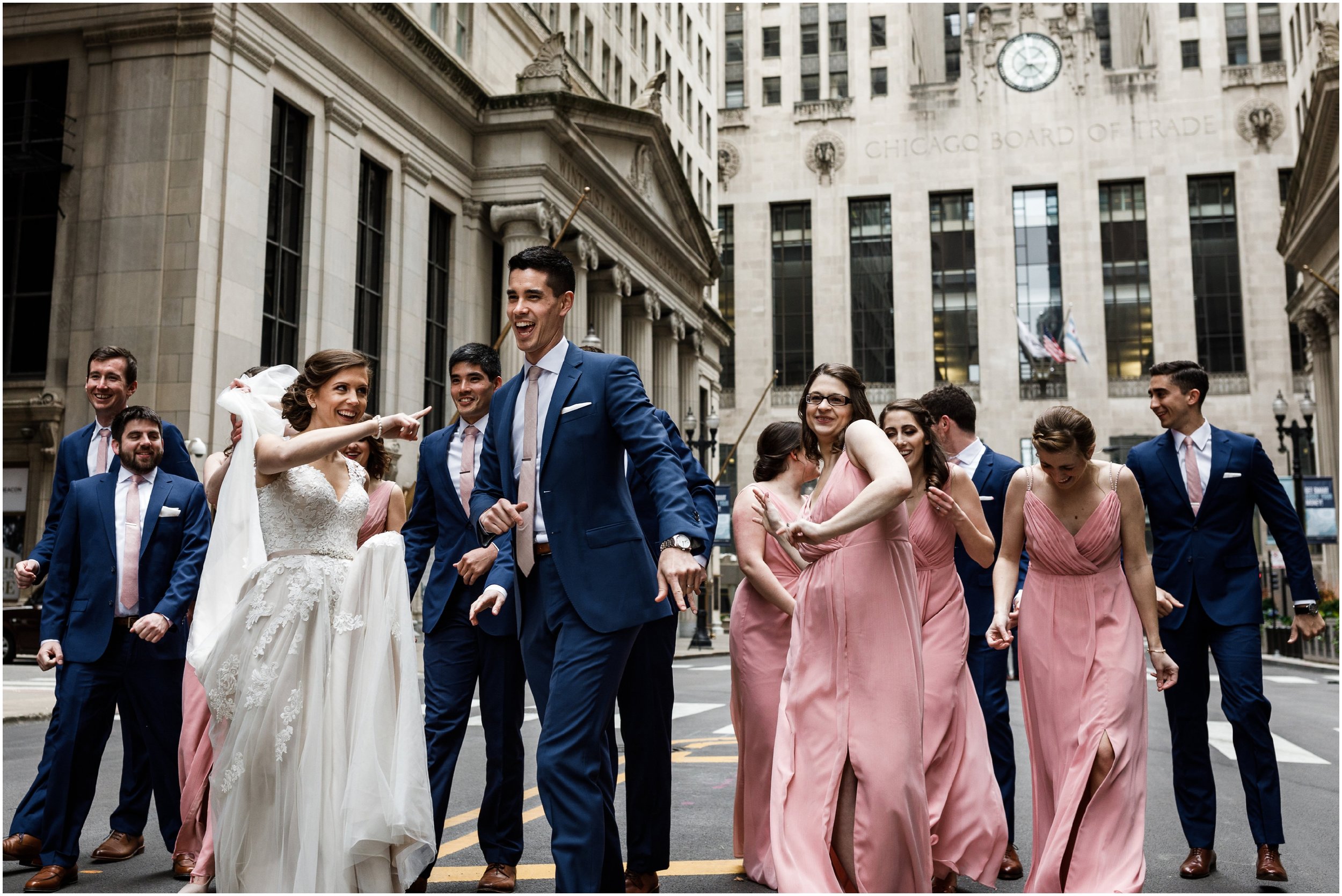 wedding party dancing in front of the Chicago Board of Trade