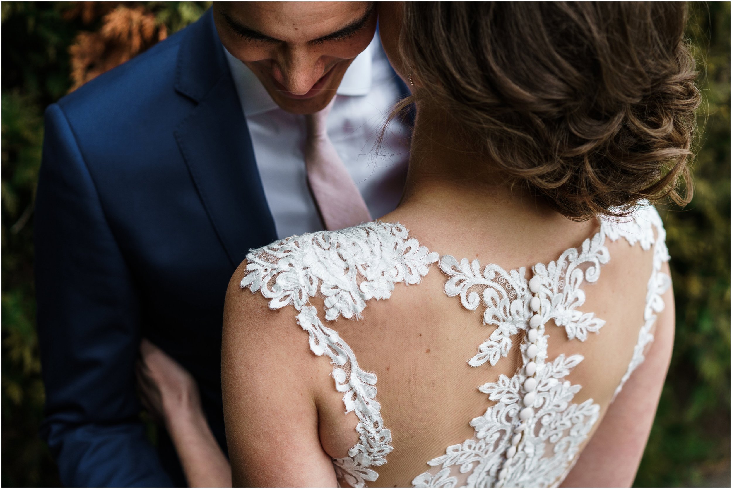 bride and groom embracing in Millennium park's Lurie garden