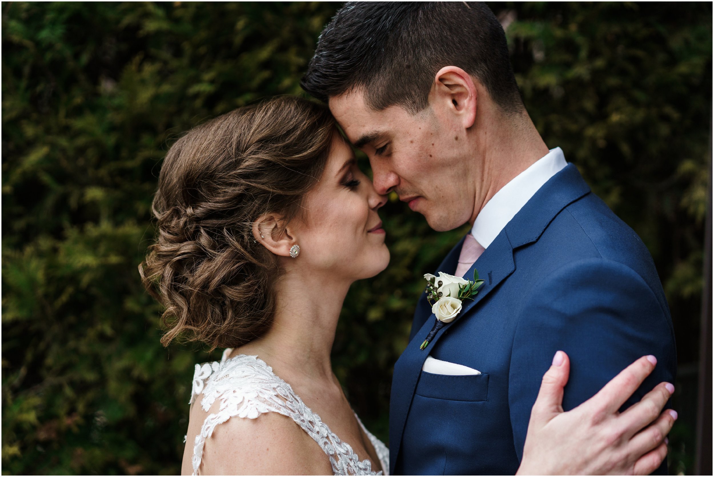 bride and groom embracing in Millennium park's Lurie garden