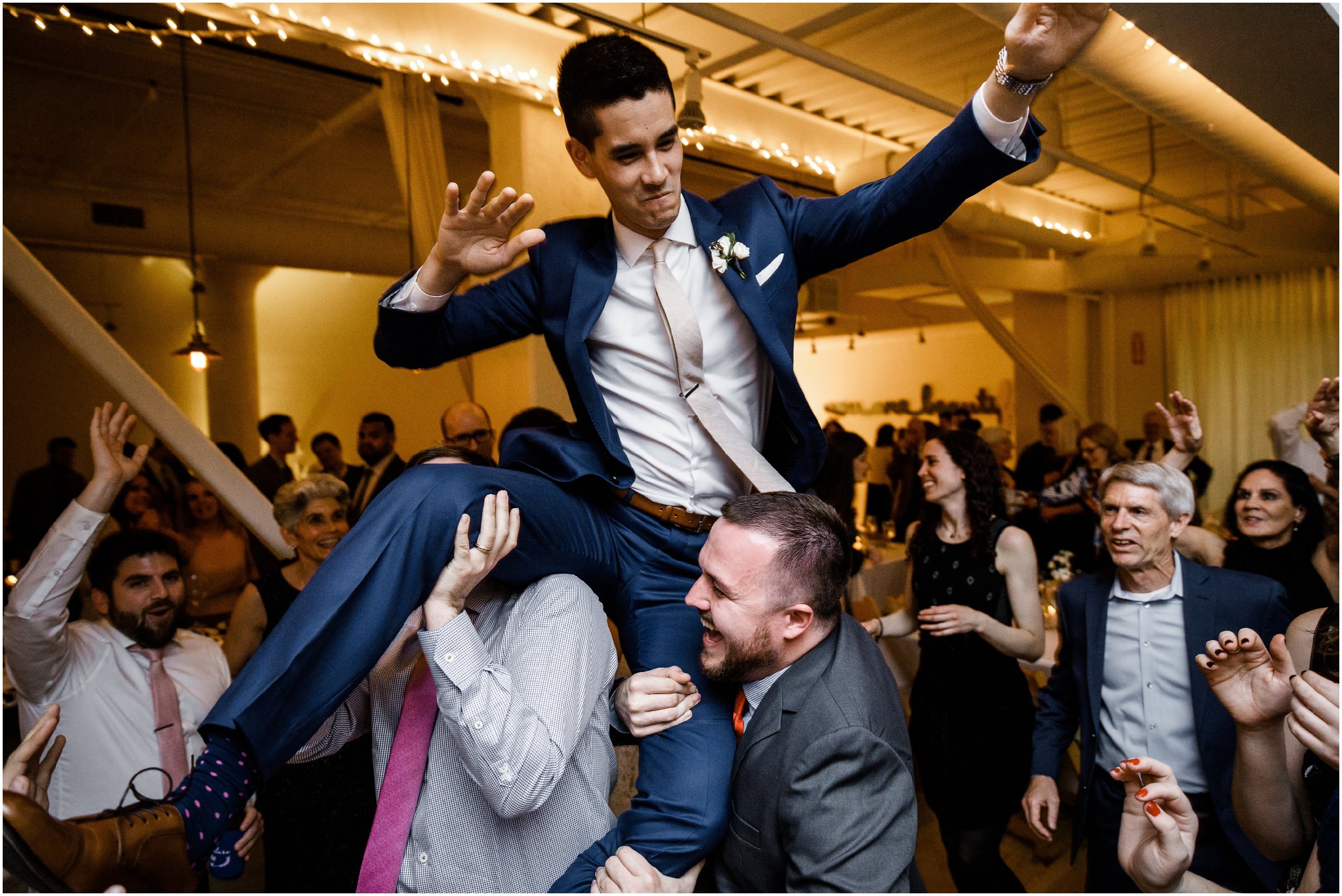 groom dancing during wedding reception 