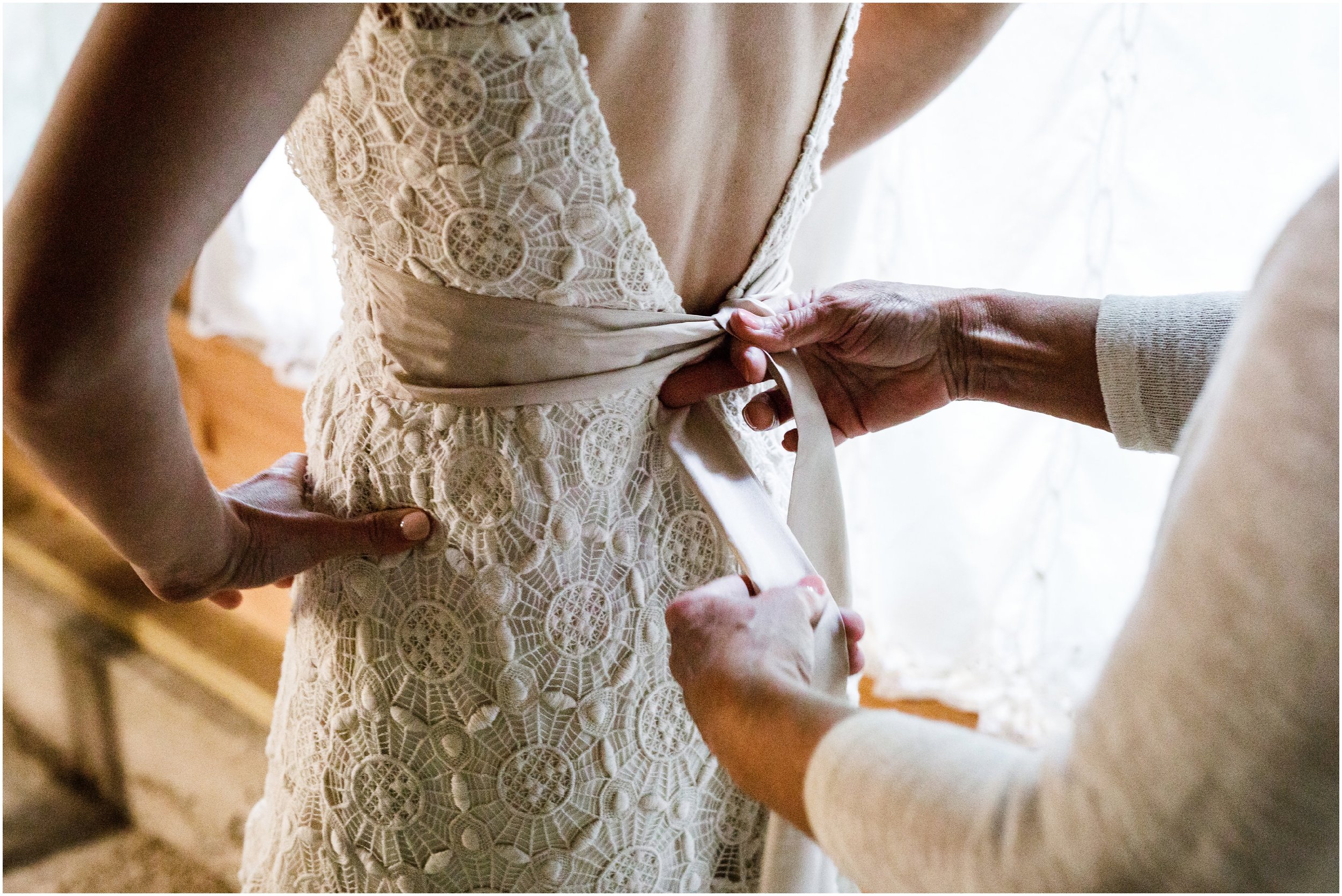 wedding dress sash being tied