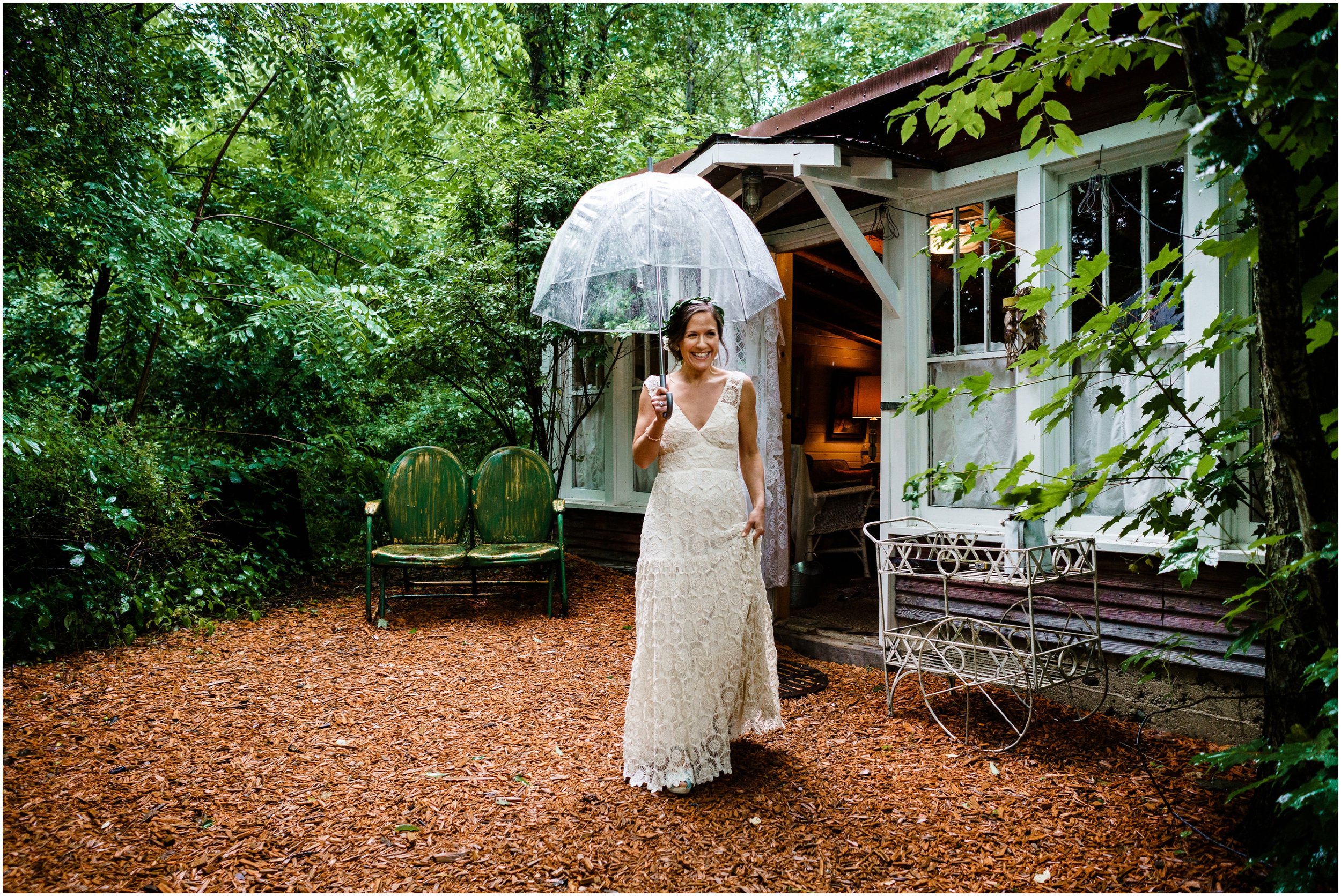 bride holding umbrella during first look
