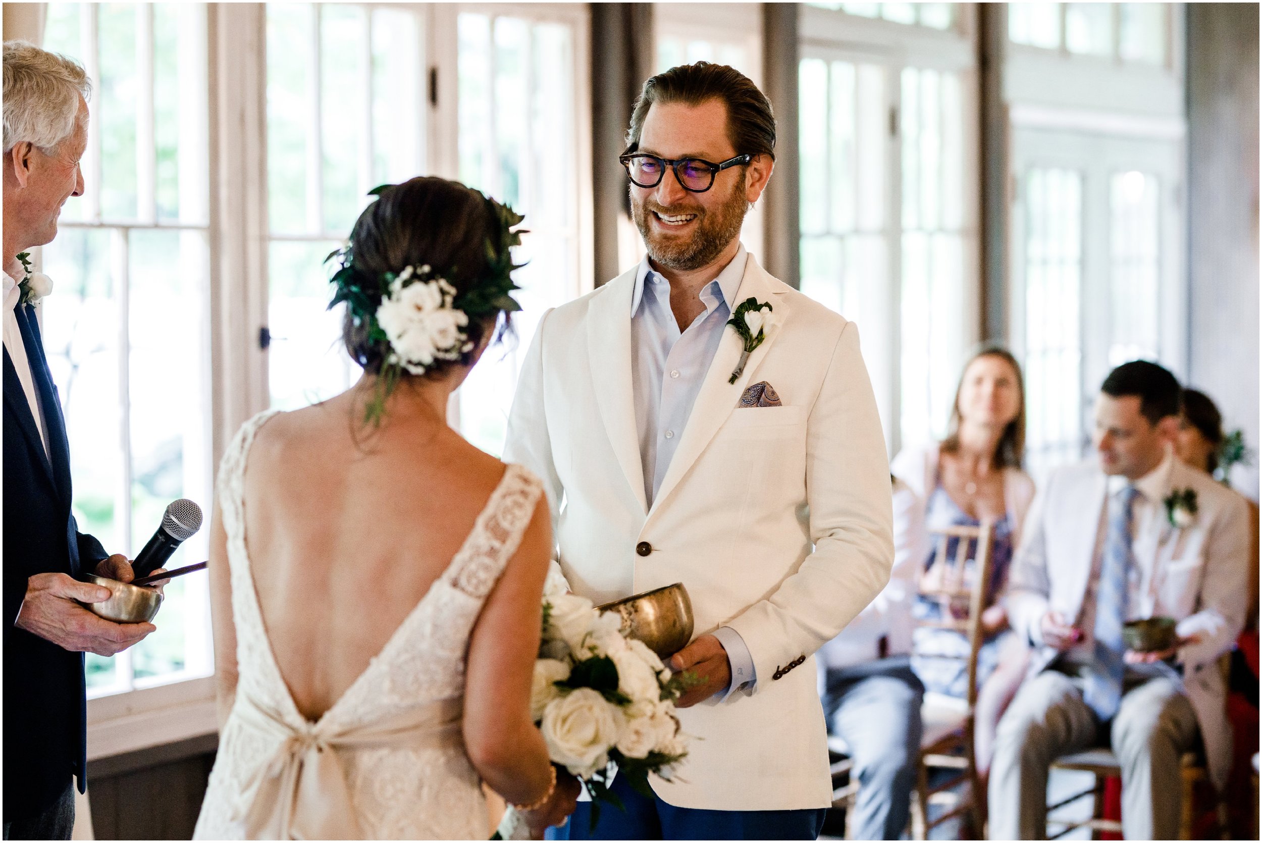 groom smiling during ceremony