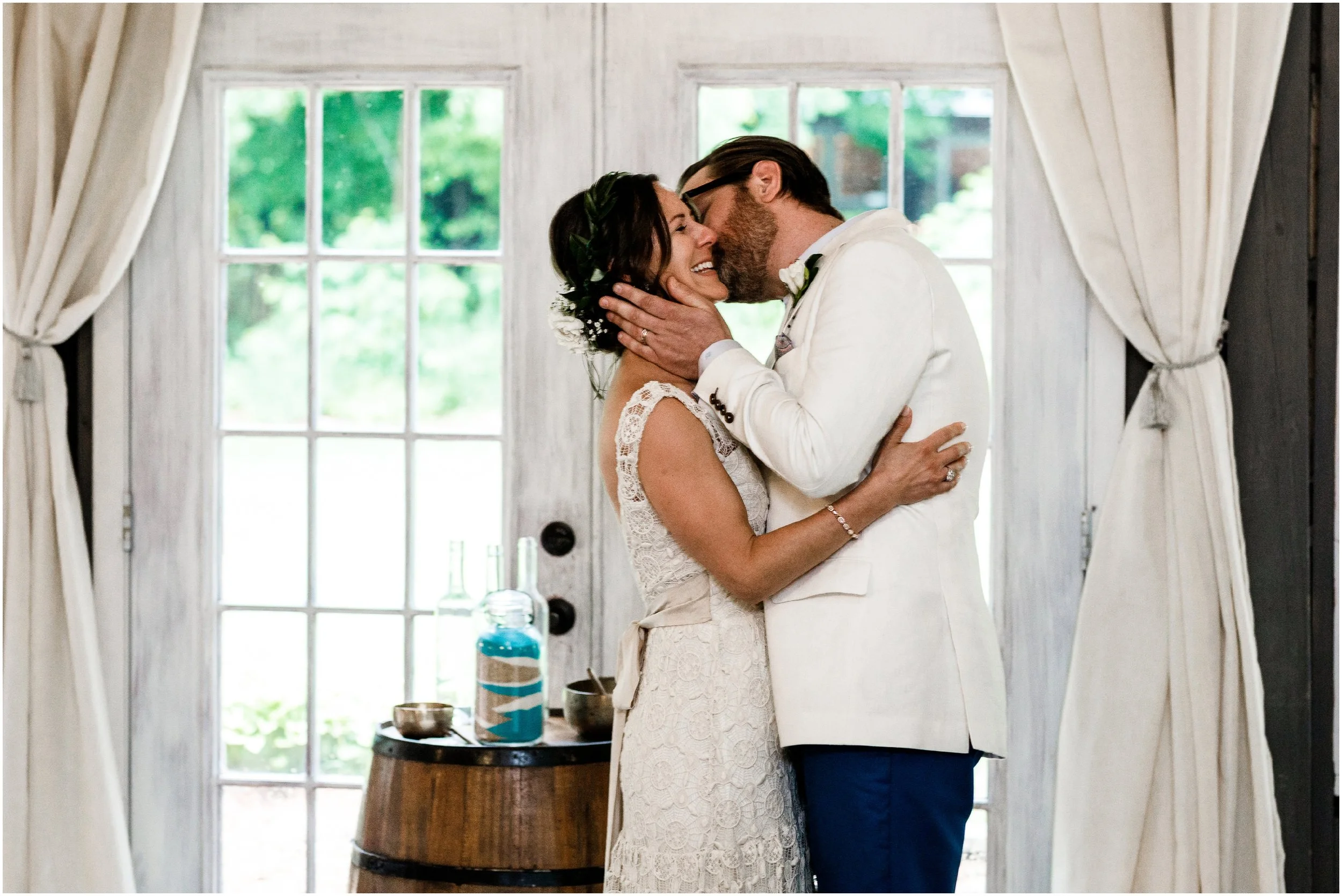 bride and groom's first kiss during ceremony