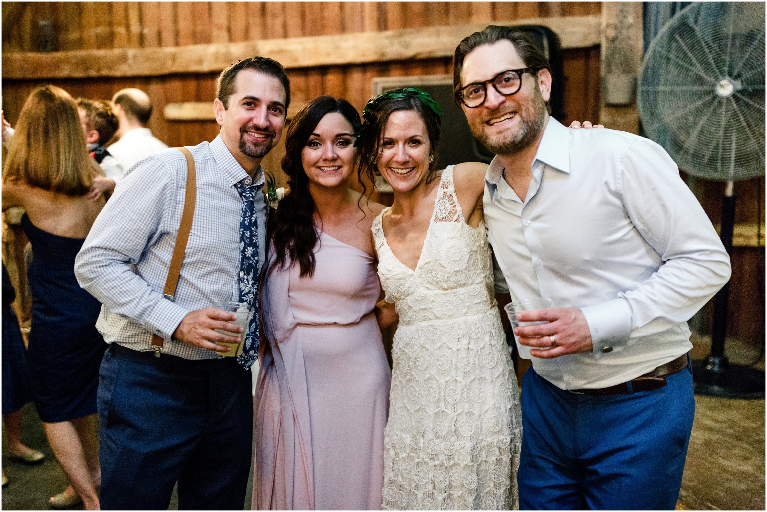 bride posing with her brother during reception