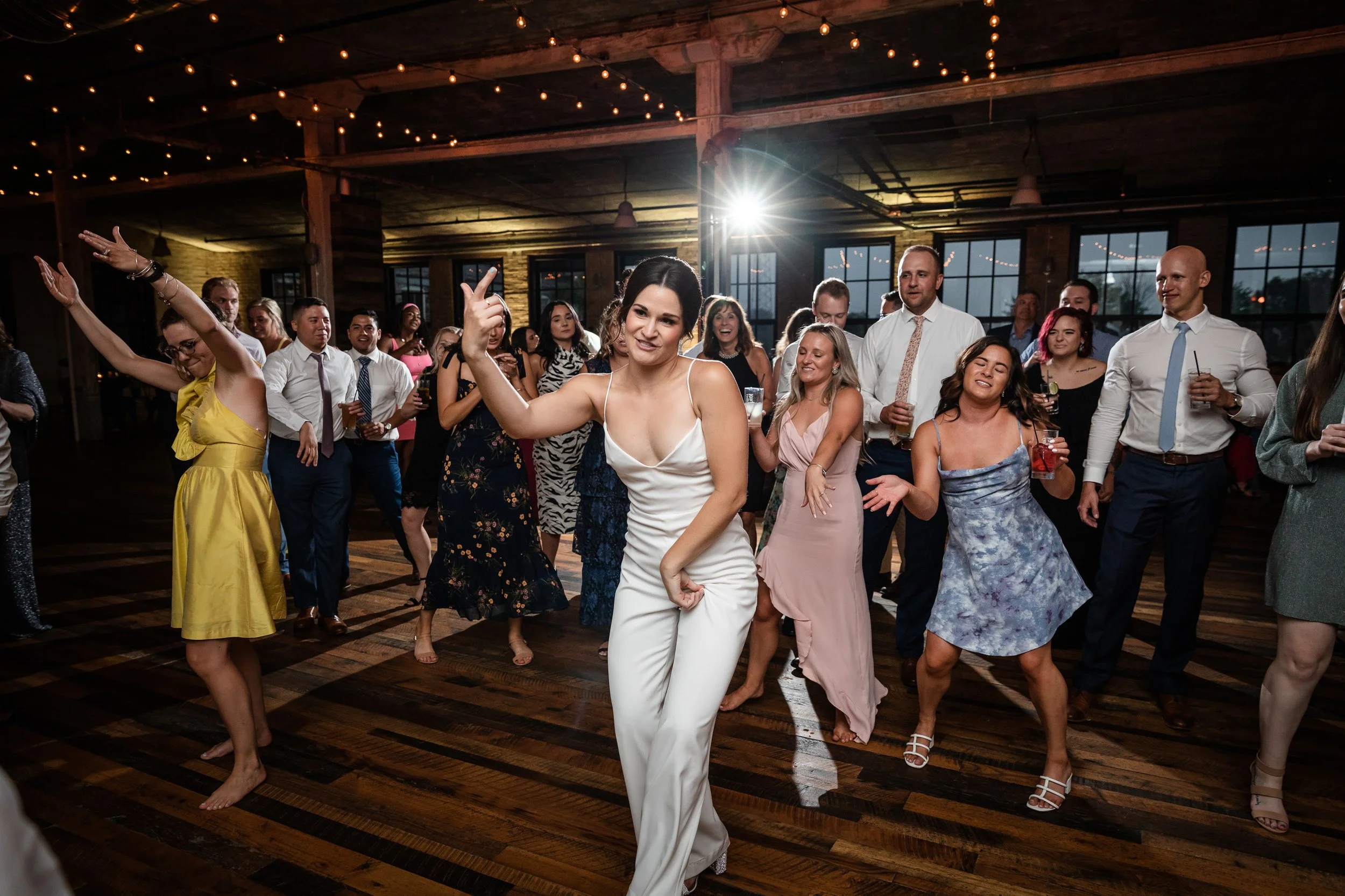 bride dancing at her wedding reception at Journeyman Distillery in Michigan