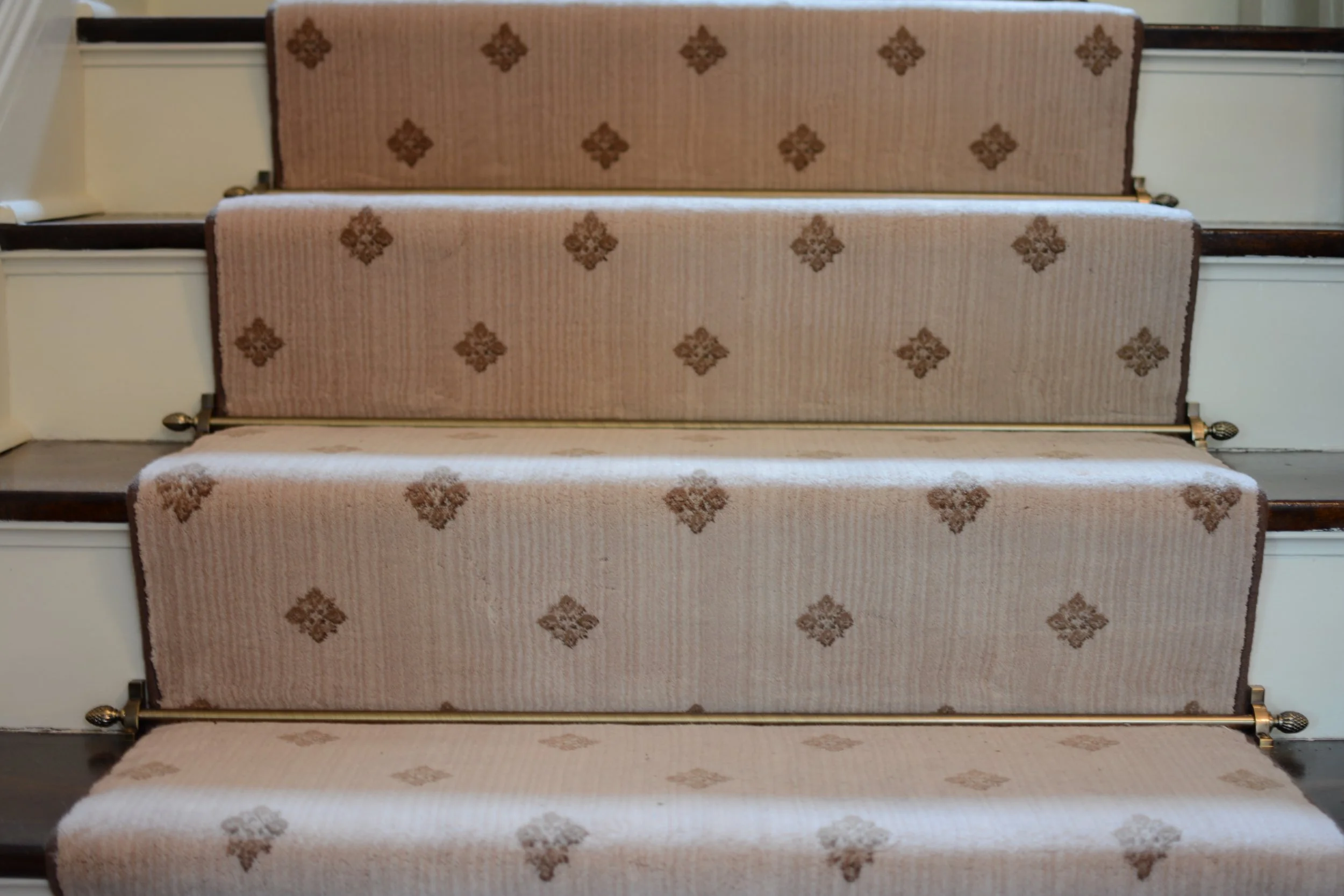 The finishes and detail of the stairway, with decorative rods, maintain the century old feel of your home.