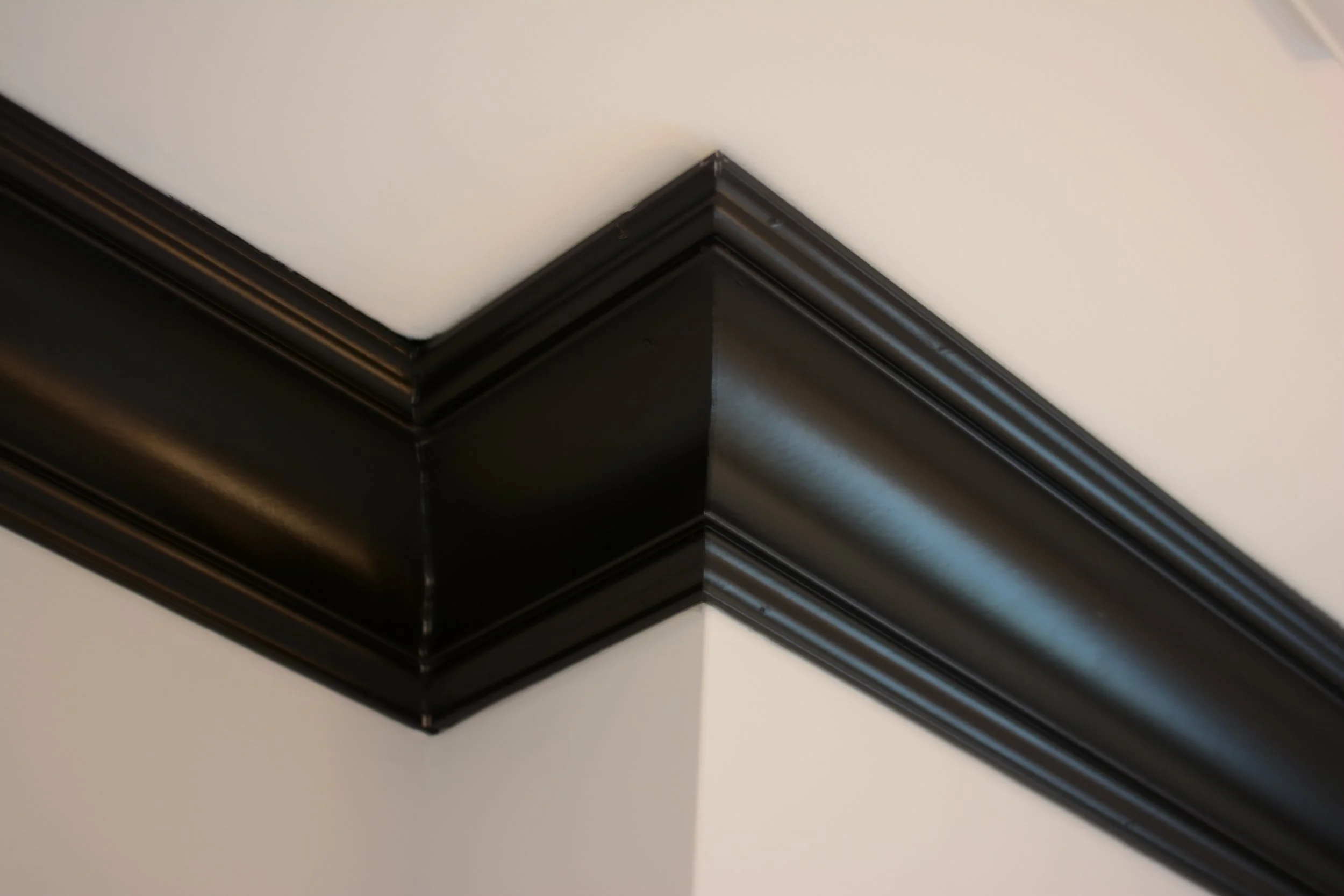 Use of a bold color on crown molding subtly dramatizes a room.