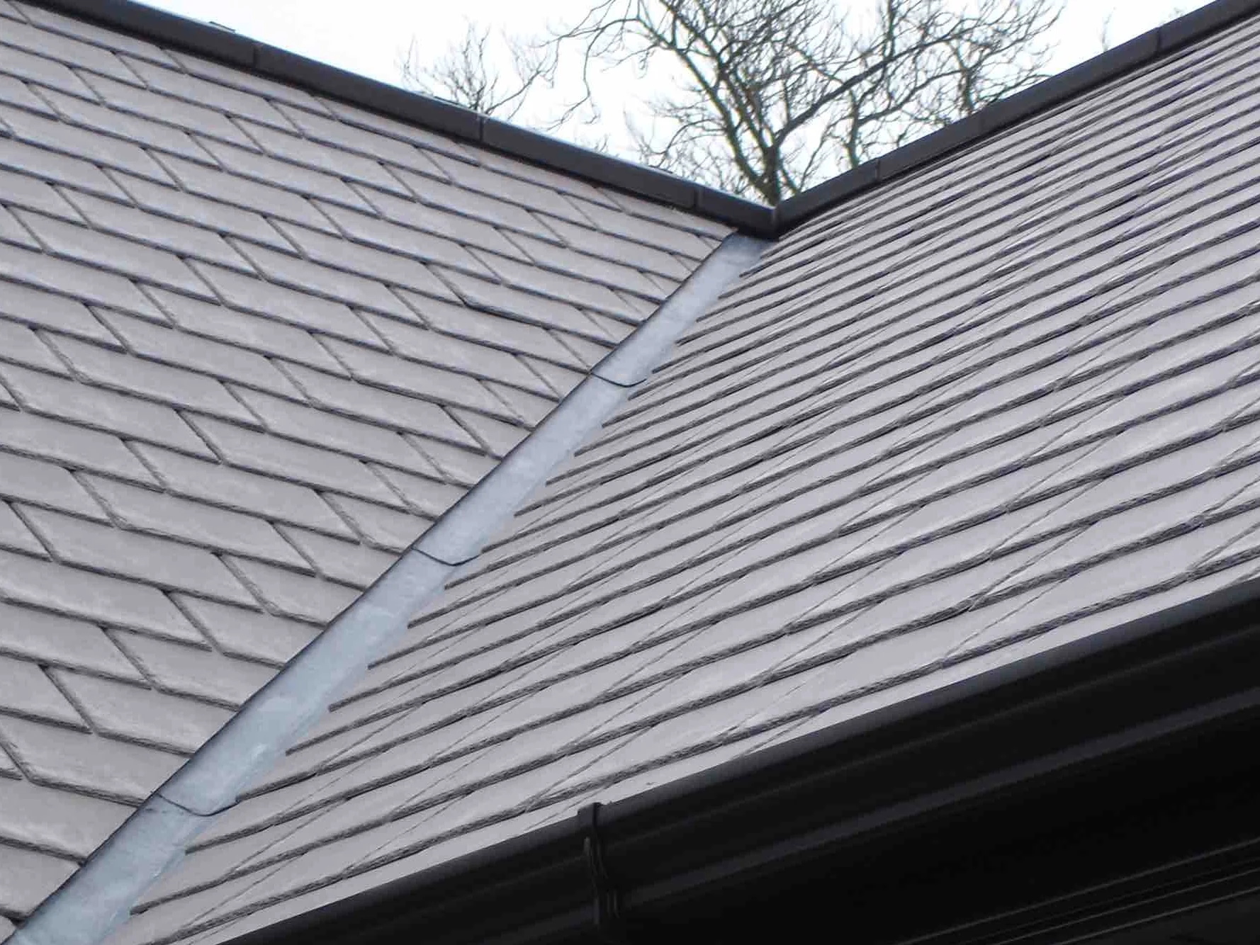 A finished Inspire slate roof in plum colour.