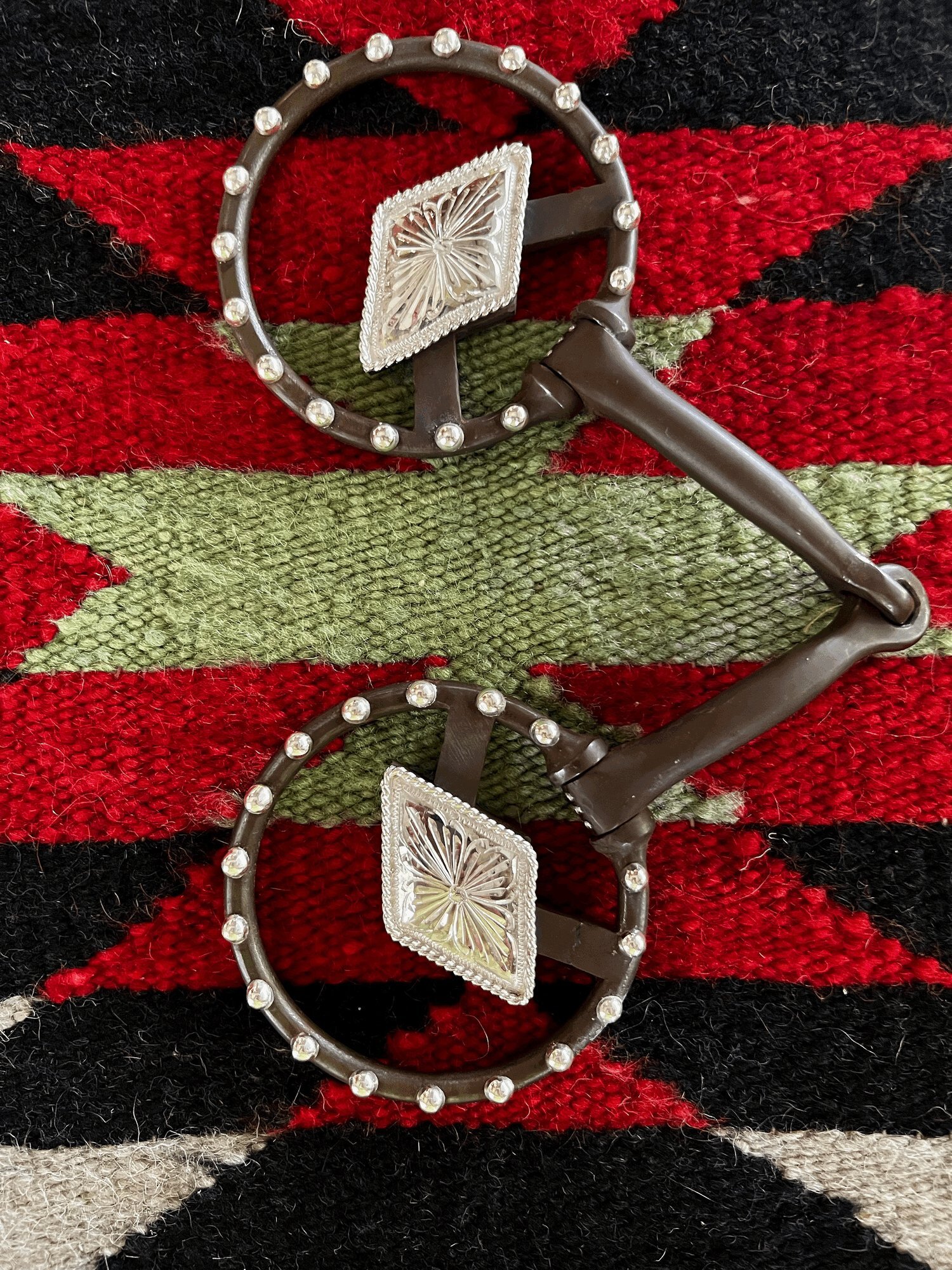 Custom Snaffle bit with large diamond sterling silver conchos, and sterling silver beading with personalized brand