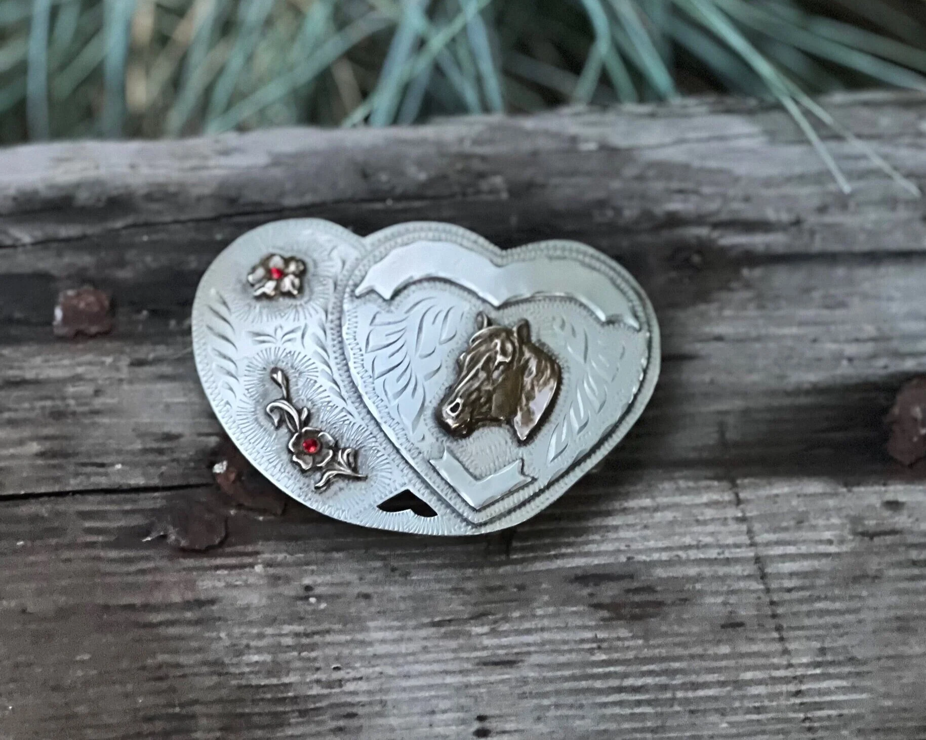 large silver double heart buckle with horses and beautiful inlaid rubies in flowers.
