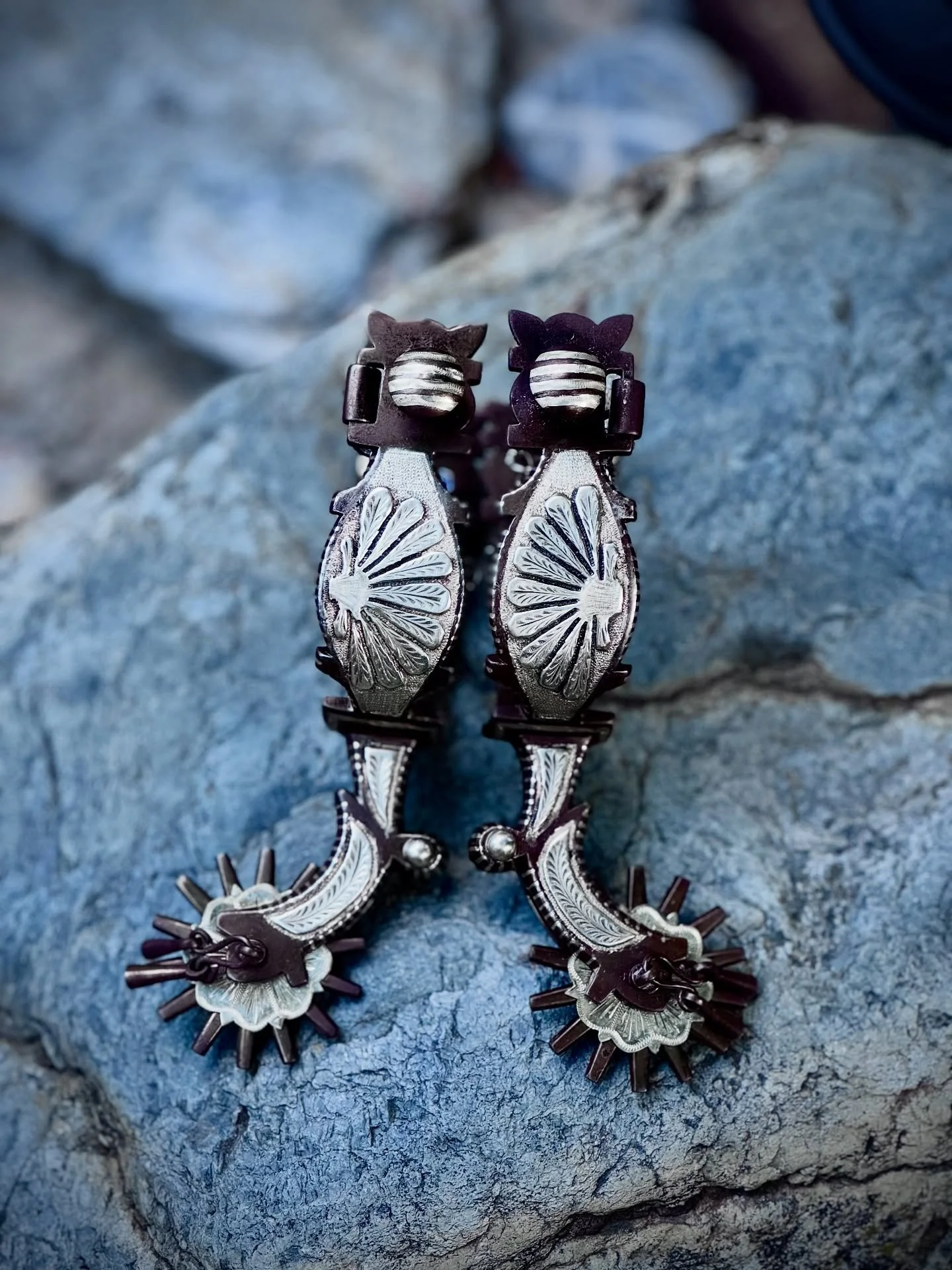 Who can resist a nicely made set of hearts that sing just as good?!! Single mounted western / California style spurs with hand engraved seashell designs, heel chains, jingle bobs and silver engraved rowel disks. Unused and ready to ride or display wi