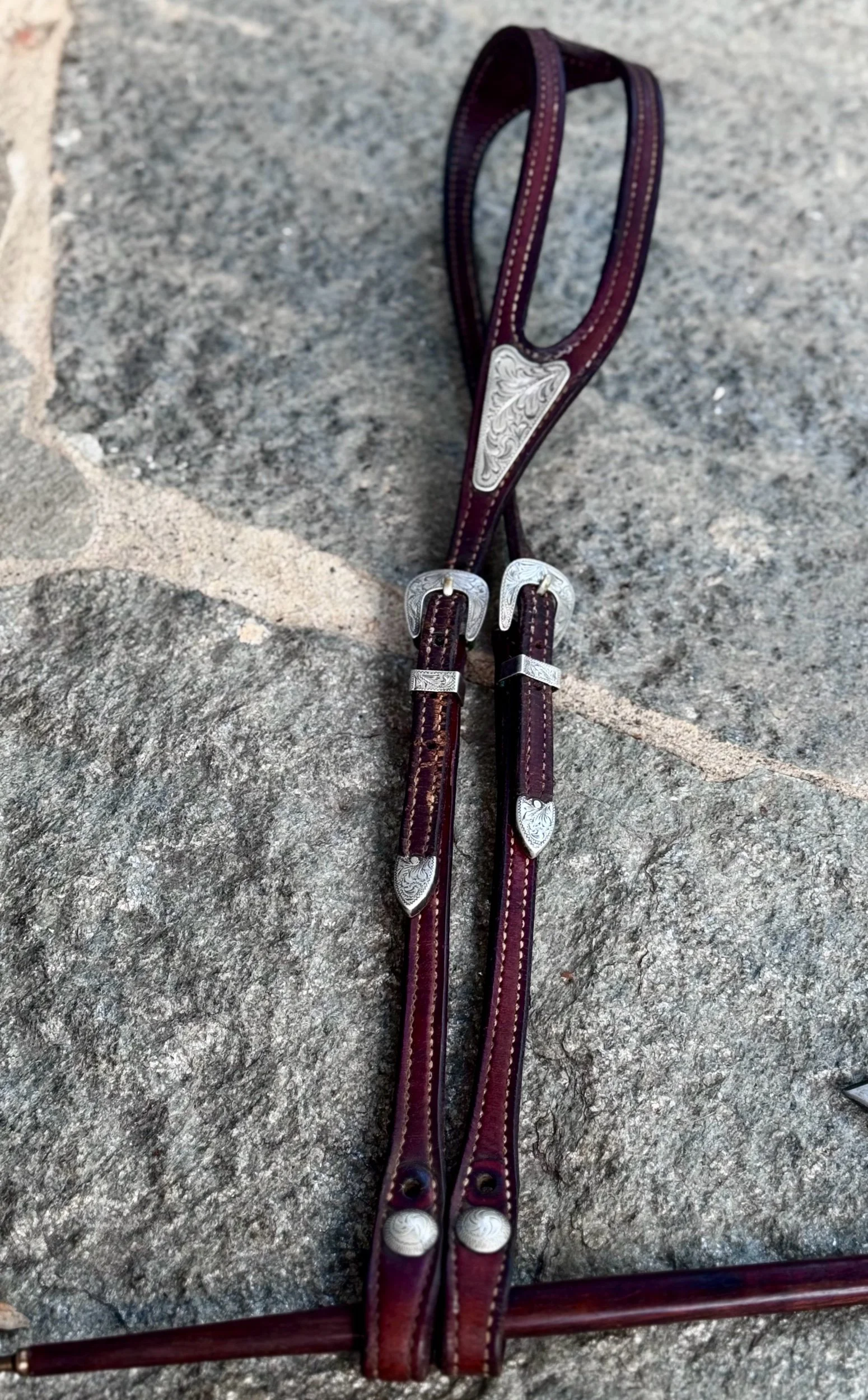 Vintage single ear headstall by Champion Turf with sterling silver buckles, keepers and ear concho
