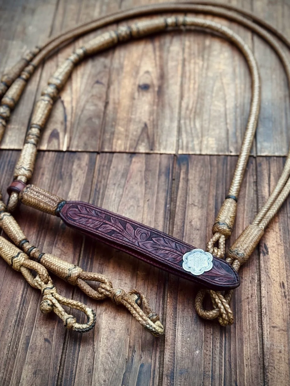 **Vintage California braided rawhide romal reins from Santa Barbara by Gilly Hernandez** 
Available for purchase here: https://theoldspanishtrading.com/rawhide-and-leather/reins-concho 
Wonderful set of braided California rawhide reins made by Gilly 