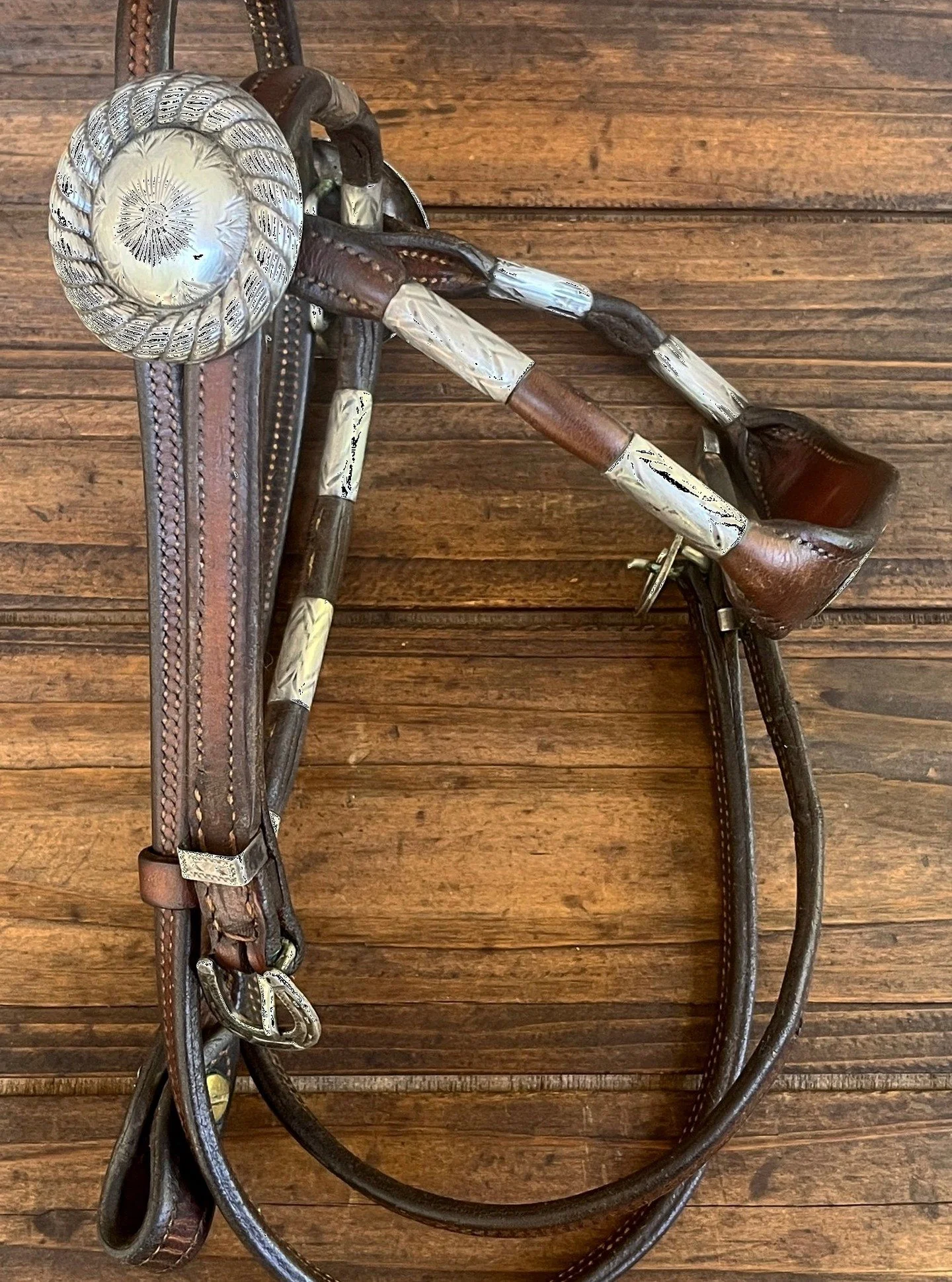Vintage Sunset Trails Partial Bridle Beautiful Sterling Conchos. 
Available for purchase here: https://theoldspanishtrading.com/rawhide-and-leather/st 

Very nice vintage Sunset Trails bridle with beautiful sterling silver hardware. Engraved barrel f