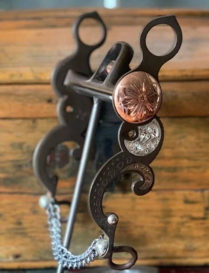 **Copper Canyon concho bit**
Available for custom order here: https://theoldspanishtrading.com/custom-bits/copper-canyon

One of my all-time favorite bit designs!! This bit features two large engraved copper conchos, sterling silver inlay, and chased