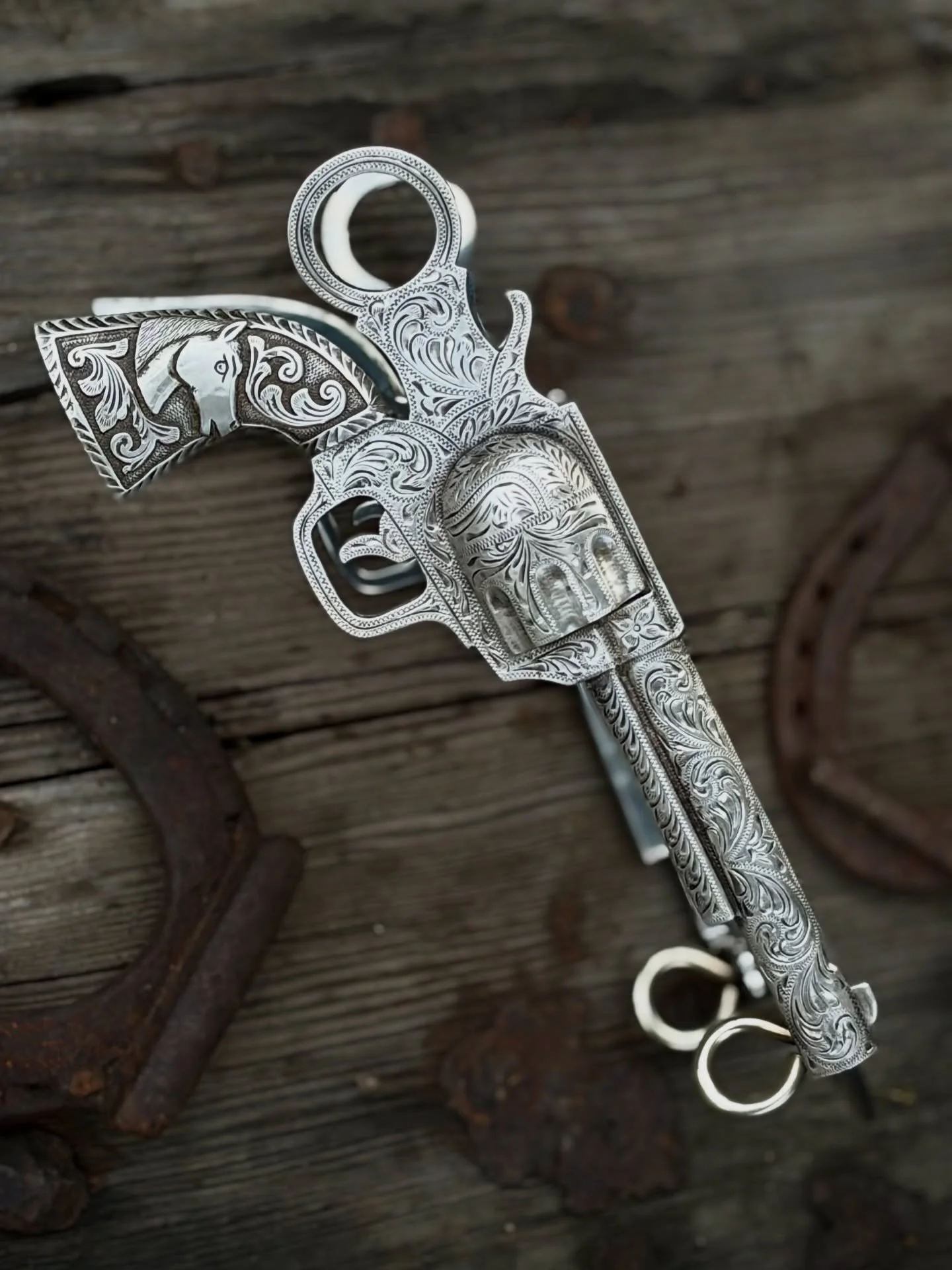 **VINTAGE Colt single action style revolver pistol bit with full sterling silver overlay by Frank Rocha**

Available for purchase here: https://theoldspanishtrading.com/bits/rocha-pistol-bit

Fantastic vintage silver bit with Colt Single Action style