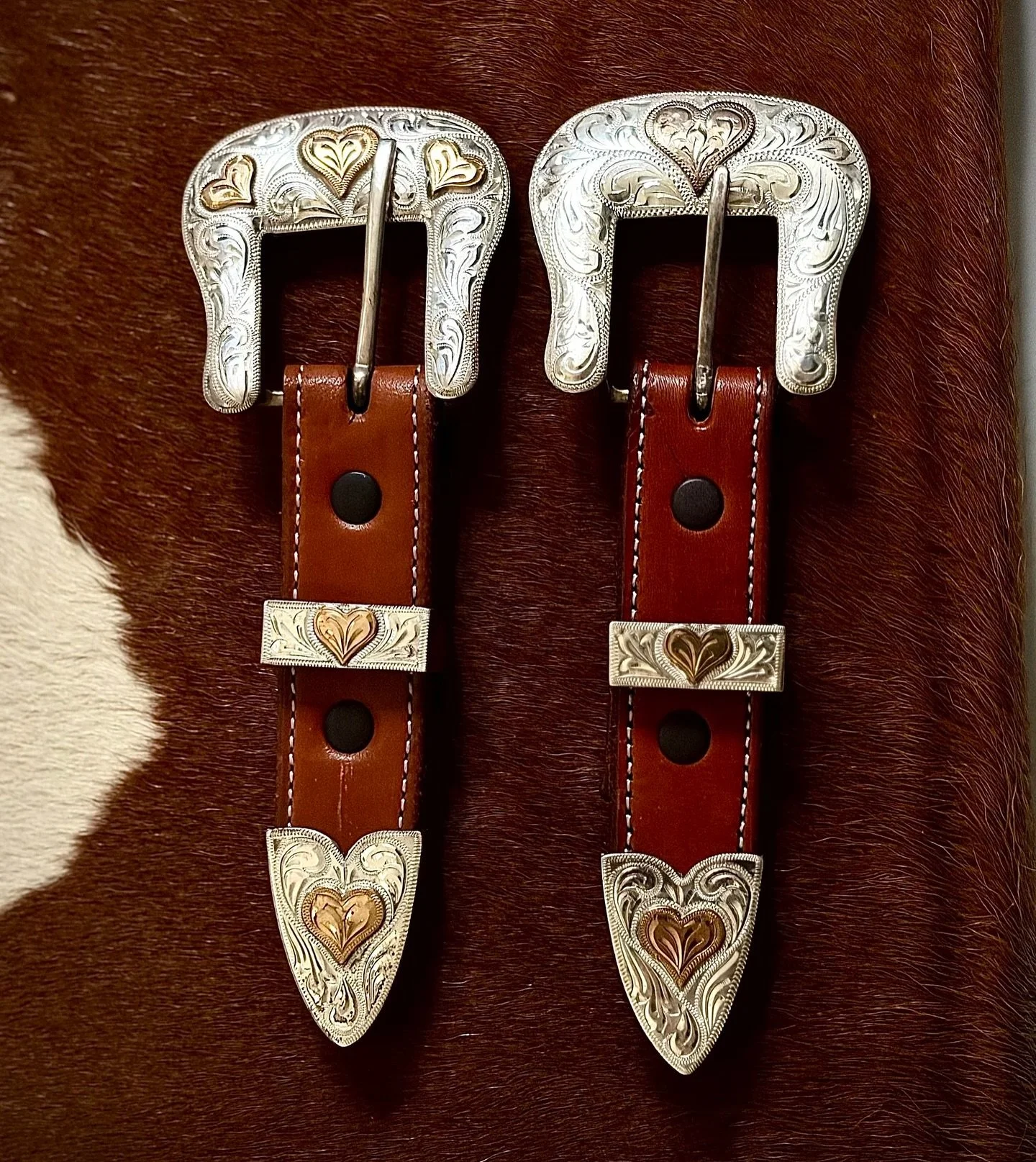 💕Vintage solid sterling silver engraved ranger buckle set with hearts. 💕 
Available for purchase here: https://theoldspanishtrading.com/silver-buckles-and-conchos/ranger-hearts 

These buckles are from an archival collection of inventory from a Sou