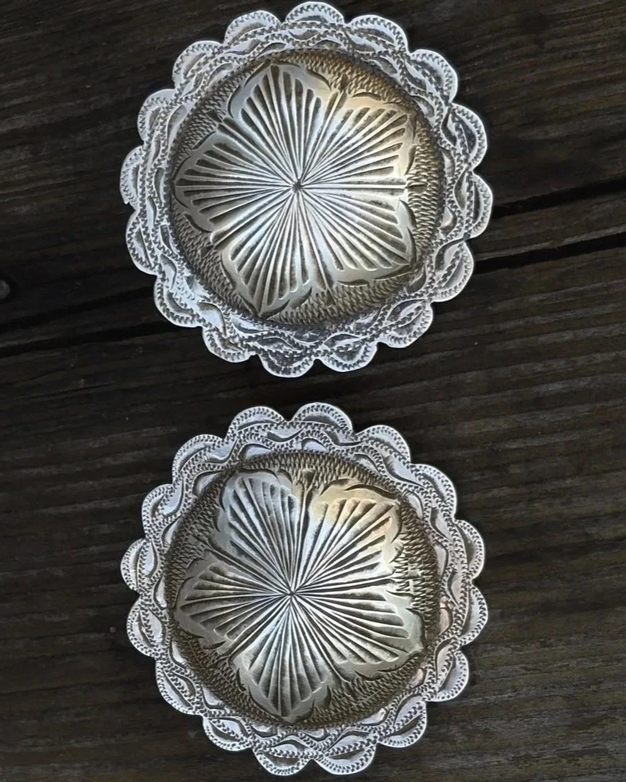 Vintage California Style Conchos marked 'STERLING'
Available for purchase here: https://theoldspanishtrading.com/silver-buckles-and-conchos/old-ca-style 
Very nice 1960&rsquo;s era matching pairs of hand engraved bridle / spur conchos. Stamped &lsquo