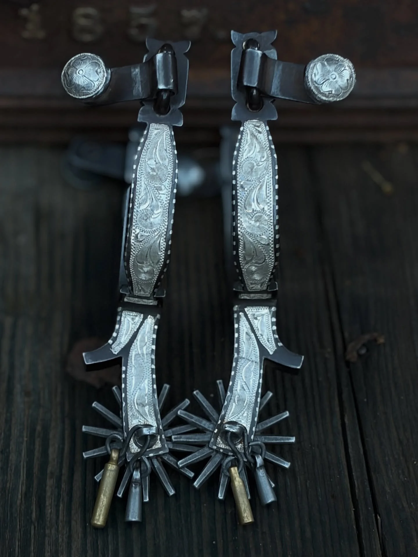 Very nice vintage E GARCIA marked California style spurs. 
Available for purchase here: https://theoldspanishtrading.com/spurs/jhk8ut8mgy75reky0j7vlgqnh9uvym 

Fancy and a nice classic style with jingle bobs. Hand engraved floral and leaf pattern sin